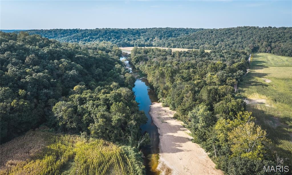 297± Acres of Turnkey Hunting & Recreation in Osage County
A true turnkey hunting property with the acreage, access, habitat, improvements, and water needed to create an exceptional private hunting camp.
Discover 297± acres in Osage County that have been thoughtfully developed with the serious hunter in mind. Predominantly timbered and offering nearly four miles of established trails, this property provides excellent access throughout the farm while making it easy to reach established food plots, secluded fields, timbered cover, and prime hunting locations.
The trail system and layout allow hunters to strategically access different portions of the property based on wind direction and hunting conditions, giving you the flexibility to hunt effectively throughout the season. Established food plots and secluded fields create attractive hunting areas, while neighboring agricultural fields provide an additional, consistent food source that helps keep wildlife using the property. Several tower blinds are strategically positioned throughout the property, including two Redneck tower blinds, providing elevated hunting opportunities and comfortable vantage points over key hunting areas.
Water is another major wildlife and recreational asset. With more than ½ mile of Third Creek frontage across two sections of the farm, the property offers live water for wildlife, fishing, and summer recreation. The clear waters are perfect for camping or summer cookouts while enjoying the refreshing water, or spend the day kayaking from one section of the farm around the bend to the other side of the property. The creek corridors provide additional habitat and travel opportunities while adding diversity to an already productive hunting property.
At the center of it all is a 2,000+ square-foot lodge featuring five bedrooms and two bathrooms. Whether you're hosting hunting buddies, bringing the family, or establishing a home base for hunting season, there is plenty of room to accommodate guests and make this a true year-round retreat.
The improvements are built for the outdoorsman. A 1,600-square-foot detached garage provides abundant space for ATVs, UTVs, boats, equipment, and gear, while also offering the perfect setup for a man cave or gathering space after a day in the field. A large hoop barn positioned along the ridge provides additional storage for tractors, implements, and larger equipment.
The property also includes productive tillable bottom ground, adding income potential while further complementing the property's wildlife appeal.
For the hunter looking for a property that is ready to enjoy from day one, this 297± acres checks the boxes: established trails, food plots, timber, fields, creek frontage, agricultural influence, quality improvements, multiple tower blinds including two Redneck tower blinds, and plenty of room to hunt and recreate.
