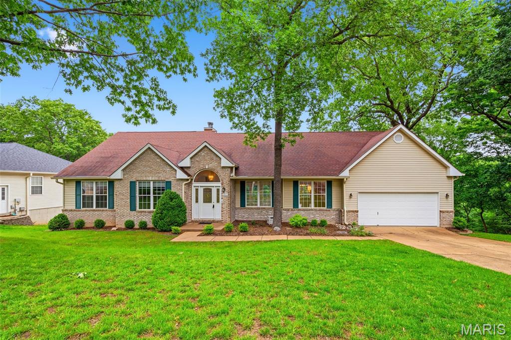 Nestled on a scenic oversized wooded lot, this stunning atrium ranch offers the perfect blend of privacy, natural beauty, and spacious living. From the moment you step inside, you’re welcomed by a vaulted living room filled with natural light and dramatic atrium windows that perfectly frame the breathtaking backyard views. The open layout flows seamlessly into the formal dining room, creating an ideal space for entertaining and everyday living.

The spacious kitchen is designed for both function and comfort, featuring abundant cabinetry, a center island, and a bright breakfast area with bay window overlooking the peaceful surroundings. Just off the kitchen, the main-floor laundry adds convenience, while the private covered deck provides the perfect place to enjoy morning coffee or unwind while taking in the wooded scenery.

The vaulted primary suite serves as a relaxing retreat with a large walk-in closet and luxurious en suite bath complete with dual vanities, separate shower, and corner soaking tub. Two additional main-floor bedrooms and a full hall bath offer flexible living options, including the perfect setup for a home office or guest room.

The finished walk-out lower level dramatically expands the living space with a recreation room featuring a bar area, an additional large family room, private bedroom, and full bath—ideal for guests, entertaining, or multi-generational living. Step outside to the expansive lower deck where the spectacular wooded backdrop truly becomes the showstopper, offering incredible privacy, tranquil views, and a one-of-a-kind outdoor setting rarely found.