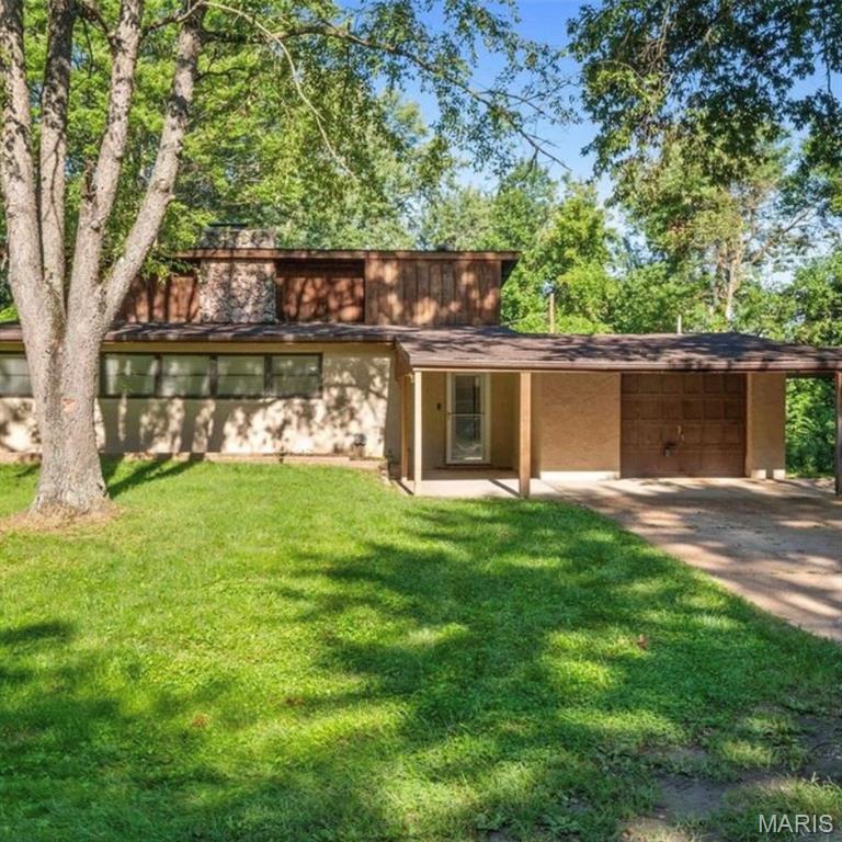 Welcome to 12215 Spanish Blvd — A Hidden Retreat in North County



Nestled on a beautifully wooded lot, this distinctive multi-level residence offers a rare sense of privacy and tranquility, surrounded by mature trees and natural beauty. Ideally located within walking distance to Spanish Lake Park and the highly anticipated Saint Louis Zoo WildCare Park, this home presents a unique blend of serenity and convenience.
Inside, you’ll find 3 spacious bedrooms and 2 full baths, thoughtfully designed across multiple levels for both comfort and character. The beautifully updated kitchen serves as the heart of the home, featuring expansive windows that flood the space with natural light while showcasing picturesque views of the lush backyard—perfect for both everyday living and entertaining.
Whether you’re enjoying quiet mornings immersed in nature or hosting guests in this inviting space, this home offers an experience that’s truly one-of-a-kind.An exceptional opportunity to own a private retreat with endless potential.
Property is being sold as-is. Seller will make no repairs or provide inspections.
