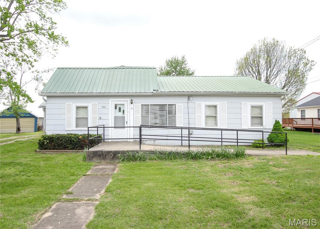 Welcome to this 2 bedroom, 1 bathroom home situated on a nice city lot in a convenient location. The home features a nice layout with a dedicated dining area, a large main-floor laundry room for added functionality and comfort, and an accessible entry with ramp. A true feature is the large, detached garage/shop offering over 2,200 square feet, concrete floors, electric, heat, and its own 200 amp service, perfect for hobbies, storage, a home business, workshop space, or entertaining guests. Relax and unwind on the covered back patio, ideal for enjoying outdoor living. Don’t miss this opportunity with great potential. Schedule your private showing today! Property is being sold as-is.