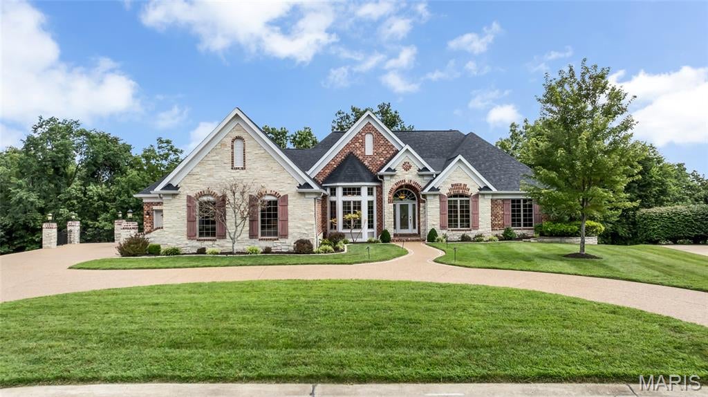 Luxury isn't just seen here, it's felt. Nestled on a .56-acre homesite in the prestigious Manors at Austin Ridge. This 4BR, 3 full bath, 2 half bath home offers an oversized 3-car garage and extraordinary attention to detail. From crown molding, exposed beams, tray ceilings, stained glass accents, and bay windows to custom archways and built-ins with an abundance of natural light throughout. Every space was thoughtfully designed and meticulously maintained by the original owners. The luxurious primary retreat features a tray ceiling, bay window seat with storage, custom walk-in closet, and spa-inspired bath with stained-glass detail, soaking tub, separate vanities, and walk-in shower. The kitchen features granite counters, built-in microwave, oven, and warming drawer, gas cooktop centered in the island, walk-in pantry, and new dishwasher. Entertain effortlessly with four distinctive gathering spaces, each anchored by a fireplace, including a hearth room, living room, media room, and expansive recreation room. The walkout lower level features 9'+ ceilings, dramatic floor-to-ceiling windows, a wet bar with dual beverage refrigerators, and a dedicated wine hobby room.  Additional highlights include a private executive office with a wall of illuminated built-ins, whole-home audio wiring, new dual HVAC systems (2025), two 50-gallon water heaters, an abundance of storage, inground sprinkler system, and a two-level composite deck overlooking the wooded views. New roof, gutters, and downspouts (2026). Backing to the renowned Katy Trail, this rare opportunity blends luxury, comfort, and craftsmanship in perfect harmony.