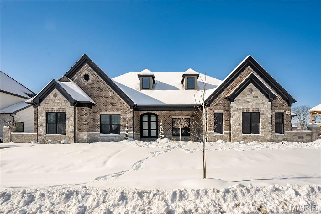 MAGNIFICENT Ranch home w/ Finished Lower Level in a FABULOUS LOCATION! This Spec House is currently under construction and will be ready to close by December 2025! Crafted by St. Louis' premier hands-on builder, Claymont Development, LLC - Wesley Byrne. The KELLY is a stunning 4 bedroom, 3.5 bath with 5,500 square feet of exquisitely finished living space. Exterior features a warm blend of brick & stone; extensive millwork; The entry foyer makes a striking first impression! Formal dining room w/ wainscoting & 2 bedrooms both with walk-in closets and a Jack and Jill Bathroom. Great Room with gas fireplace, built in shelving. Gourmet kitchen features custom cabs, granite counters & 9-ft island! Luxury owner’s suite w/ dual closets. 4-car garage! Sensational Lower Level includes brick/stone wet bar, huge rec-room, 4th bed & full bath. Tour is of the Display Home; Pictures are of previously built Kelly Model.