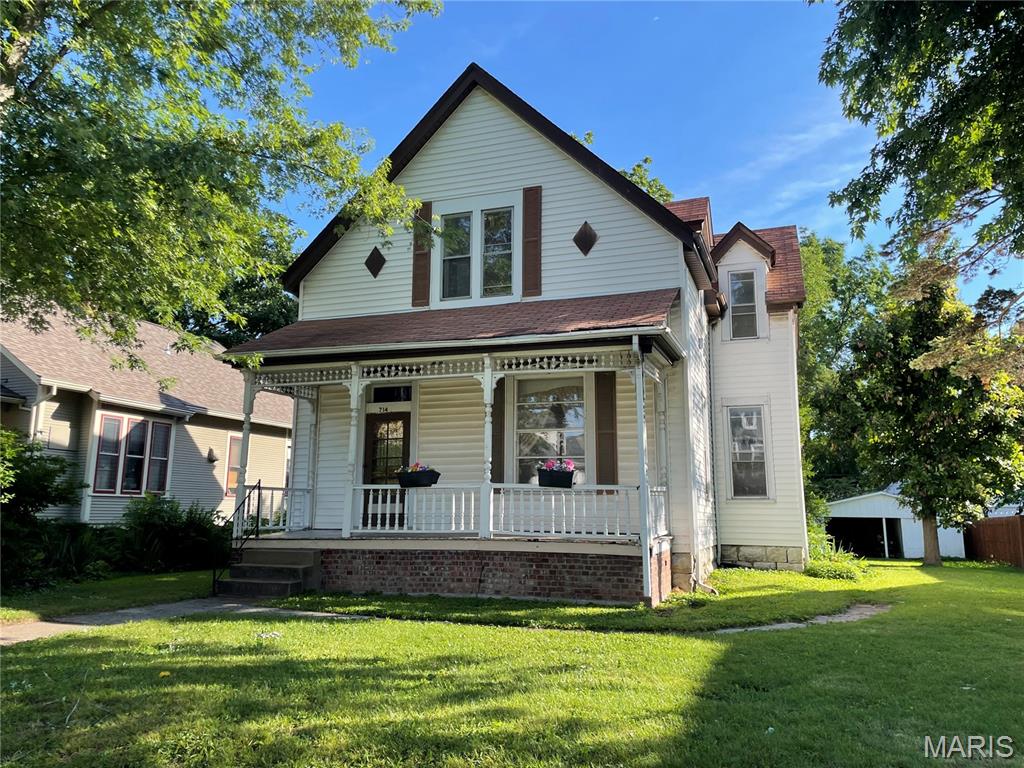 Circa 1900 Folk Victorian. Selling AS-IS. Needs complete rehab. All systems are in bad shape, Roof, Plumbing, Electrical, etc. House will not qualify for traditional financing. This is one of the last untouched big homes in the neighborhood. Presenting an incredible opportunity for the right buyer to rework this home and gain sweat-equity. 3 potential upstairs bedrooms, with a full bath. Main floor master with en-suite bathroom. There's also small half bath with laundry off the kitchen. Detached garage off Alley. Large lot with lots of big trees. Located on one of the nicest historic streets in St. Charles.