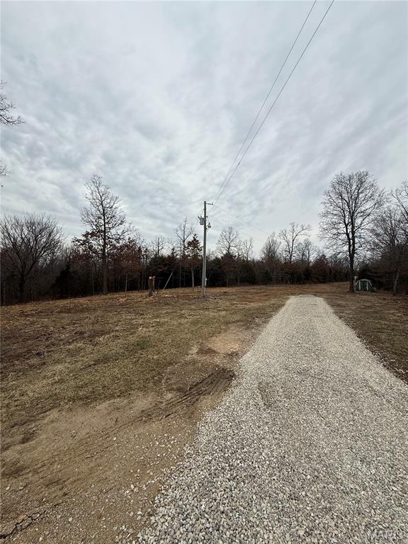 Nestled in the peaceful countryside, this beautiful recently surveyed 4.15 acre tract offers the perfect blend of privacy, versatility, and opportunity. Located in the desirable Joel E. Barber School District, this property provides a quiet rural setting while still being within reasonable distance to town amenities. With plenty of room to spread out, the land is well-suited for building your dream home, placing a mobile or manufactured home, or creating a weekend getaway. The acreage also offers great potential for hunting, outdoor recreation, or simply enjoying the natural surroundings. Whether you’re looking for a homesite, recreational property, or a slice of country living to make your own, this tract offers endless possibilities. Property is on county water and Laclede electric