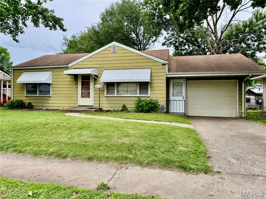 Great Investment Opportunity with Loads of Potential!  Bring your vision and personal touches to transform this property into a wonderful home!  Whether you’re an investor or a buyer looking for a project, this home offers a fantastic opportunity to build equity and make it your own!
This 2-bedroom, 1-bath home offers original hardwood floors throughout most of the main level....Living Room, Dining Room and Bedrooms! The primary Bedroom has two closets!  Dining Room has Large pantry closet for added storage!  The kitchen appliances, washer, and dryer are all included!  The partially finished basement provides additional living space, along with a dedicated storage room and unfinished storage area!  You’ll also appreciate the oversized attached 1-car garage, with attic storage, and attached outdoor storage space! Newer A/C condenser and water heater!  Outside, enjoy a fenced backyard...perfect space for outside fun or relaxation!  Home is to be sold as-is, sellers will do no repairs or pass occupancy inspection.