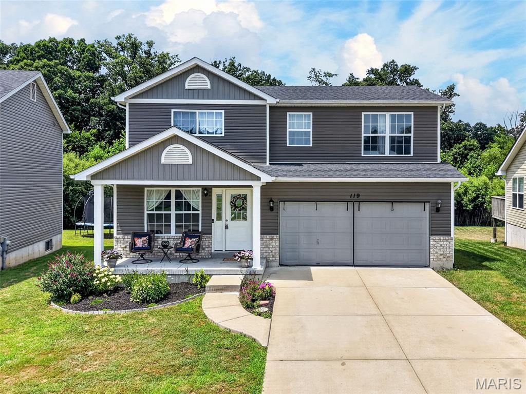 Welcome to this bright, beautifully maintained two-story home offering over 1,700 square feet of comfortable living space, 4 bedrooms, 2.5 baths, and flexible spaces designed for today's lifestyle. The inviting main level is filled with natural light and features an open, functional floor plan anchored by a stunning kitchen with quartz countertops, custom 42-inch cabinetry and stainless-steel appliances. Sliding glass doors off of the breakfast room open to a spacious deck overlooking the fenced backyard—perfect for grilling, entertaining, or simply relaxing while enjoying peaceful views of the common ground and wooded backdrop. An added convenience is a large main-floor laundry room. Upstairs, you'll find a versatile loft that could serve as a home office, three spacious bedrooms, including a generous primary suite with a private bath, plus a second full bathroom serving the additional bedrooms. The partially finished lower level adds exceptional living space with a large recreation room, a charming custom play nook tucked beneath the stairs, and a true fourth bedroom with an egress window. Outside, enjoy multiple outdoor living spaces with the expansive deck and a patio featuring a built-in fire pit, all overlooking the private backyard and scenic common ground with woods beyond. The neighborhood offers amenities everyone will love, including a community pool, playground, basketball court and popular community events like food-truck nights that make it easy to connect with neighbors and enjoy an active lifestyle. Conveniently located just one mile from the interstate for an easy commute, this exceptional home offers the perfect combination of space, flexibility, outdoor living, and neighborhood amenities—all while providing a wonderful opportunity to build equity in a fantastic community.