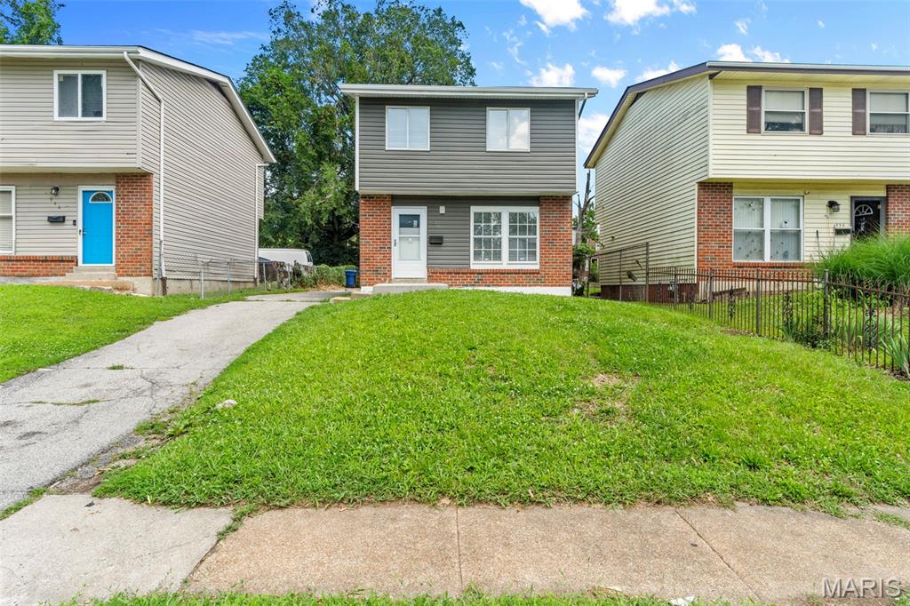Completely renovated from top to bottom and move-in ready! This stunning 2-story home offers the perfect blend of modern updates and classic charm. Nearly everything is NEW, including the roof, siding, HVAC, A/C, water heater, and front and rear concrete porches. Inside, you'll find luxury vinyl plank flooring throughout, with luxury vinyl tile in the kitchen/dining area. The updated kitchen features stainless steel appliances, a gas stove, and plenty of cabinet space. Brand-new washer and dryer are included! Upstairs offers 3 bedrooms and a full bath, including an impressive primary bedroom. A convenient half bath is located on the main floor. Enjoy the large, level fenced backyard, off-street parking with driveway, and a location just minutes from the Delmar Loop's restaurants, entertainment, shopping, and nightlife. Why buy a home that needs work when everything has already been done for you? Schedule your showing today!