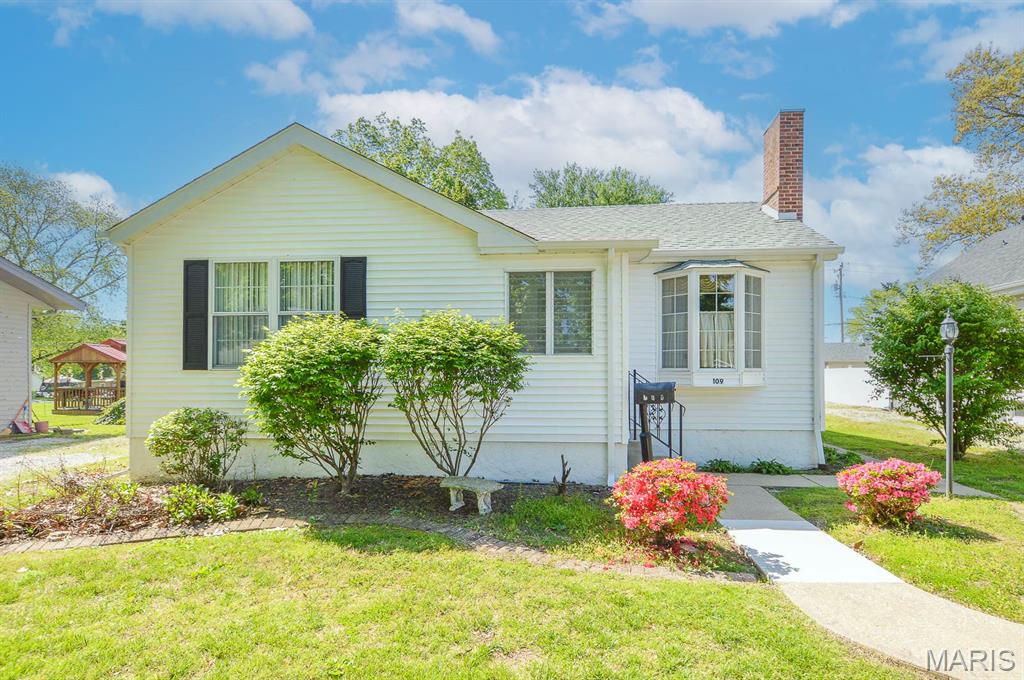 Price listed is Starting Bid Only. Bidding starts closing 6/3/2026 @ 5 p.m.  Bring your vision to this charming 2BR/1BA home in O’Fallon, IL, offering exciting potential with a detached garage and full basement. A welcoming foyer leads into a sun filled living room where a wood burning fireplace and bay window create the perfect cozy atmosphere. The dining room flows easily into the kitchen, making everyday meals and gatherings a breeze. Need extra space? A flexible bonus room off the kitchen is ideal for a home office, playroom, or second living area. It connects to a sunken mud room with exterior access and laundry hookups for added convenience. Two comfortable bedrooms share a centrally located full bath that is ready for your personal updates. The full unfinished basement offers endless possibilities, storage, workshop, or future finished living space. Outside, enjoy a fully fenced backyard with alley access to the detached garage, plus additional parking in the front gravel driveway. New roof, siding and storm door replaced in 2024 Set on a 0.18± acre lot close to schools, shops, restaurants, and downtown O’Fallon, this home is full of potential and ready for its next chapter. Property will sell under auction terms and be sold AS- IS, WHERE-IS. Seller, will not make any repairs as a result of any building, occupancy, or environmental inspections. Buyer will be required to sign an Auction Purchase & Sale Agreement if final bid is accepted by Sellers.