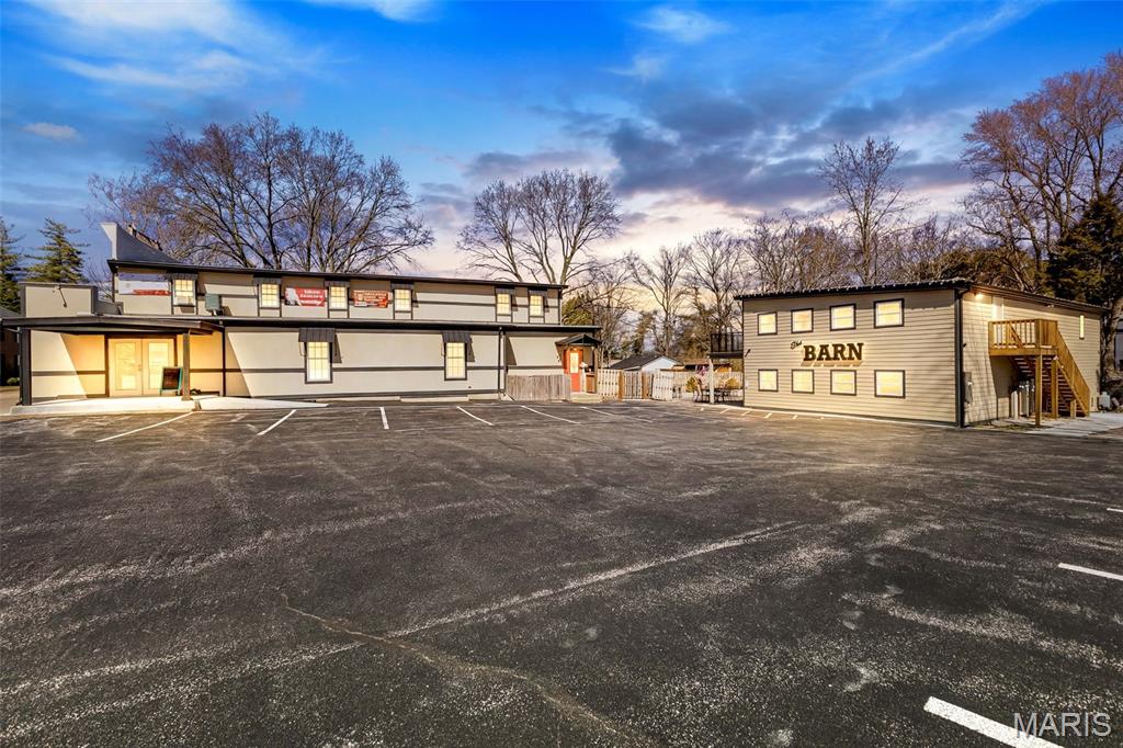 Rare Two-Parcel Commercial Opportunity | Historic Building | This exceptional commercial offering includes two buildings on separate parcels, combining a former established income-producing business, a historically significant structure, and substantial future expansion potential. Tavern Building, & some contents Included. The former tavern features over 3,500 square feet across two finished levels and was a productive, well-established operation. Some contents are included in the sale but this building can now has endless possibilities. Built new from the ground up with no expense spared, this structure was thoughtfully designed for long-term durability, efficiency, and growth.
Notable features include: 400-amp electrical service, Plumbing engineered to be highly freeze-resistant with easy access for service, Top-of-the-line, energy-efficient coolers, Infrastructure in place for future expansion, including gas service and plumbing to the rear patio for a potential outdoor presentation kitchen, SmartSide Diamond Coat siding, Commercial-grade True brand equipment, made in St. Louis, Solid oak bar, locally milled by Stone Tree, Bar seating constructed with exceptional wear-resistant materials, exceeding standards used by Vegas casinos, Integrated sound and camera systems, Flooring designed for easy maintenance and repair, LED halo lighting with adjustable color and brightness, A durable patio built to support long-term use and future enhancements. The main level formerly operated as a busy, successful tavern, while the finished upper level provided flexibility-ideal for special events, private functions, or conversion into a custom concept or dream project. The second building, built in the 1850's, offers approximately 5,000 sq ft and blends historical character with income potential. Main level is over 3000 sq ft that houses a salon(400 sq ft)with a long-term tenant, providing steady rental income. Full upper floor with strong potential for residential rental living space, owner occupancy, or additional income use (buyer to verify). This is two parcels with with separate buildings. Turnkey business with high-quality construction and systems. Multiple income streams, Expansion-ready infrastructure, Historic appeal with modern functionality. This is a rare opportunity for investors, owner-operators, or entrepreneurs seeking a profitable business, character-rich property, and long-term growth potential in one compelling package.