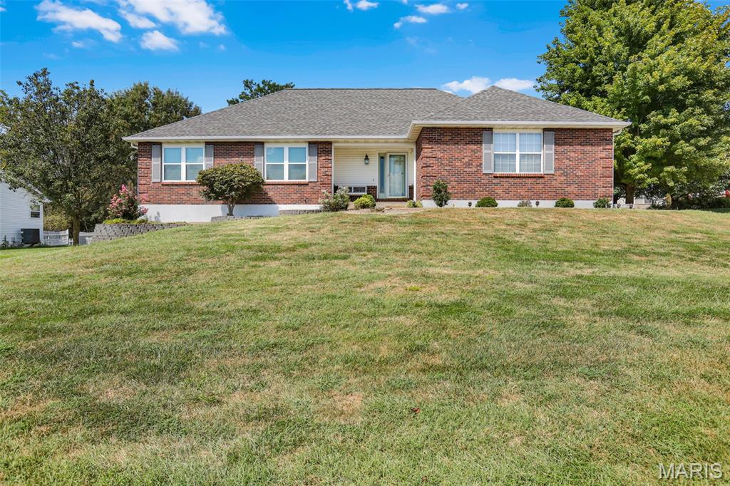 Welcome Home to this meticulously maintained 2BR/2BA ranch home offering over 1600 sq ft of comfortable main level living in a beautiful lake community!  Ideally situated with lake access right across the street, this home offers the perfect blend of space, convenience and peaceful setting.  Step inside to a spacious great room featuring vaulted ceilings and fireplace with plenty of room to relax or entertain.  The well appointed kitchen offers an abundance of cabinetry, Corian countertops and a convenient breakfast bar.  A separate dining area walks out onto a screened in patio, the perfect spot for morning coffee, evening relaxation or just enjoying the outdoors.  The large primary suite is a true retreat with TWO walk in closets and a spacious private bath featuring dbl sink vanity, large separate shower and jetted tub. Main floor laundry adds everyday convenience.  An oversized two car agrage provides plenty of room for vehicles, storage and more.  A full unfinished basement offers endless possibilities and is ready for your custom finishes!  This move in ready ranch home combines easy one level living, a fantastic floor plan, screened outdoor living and lake access in one inviting package. Don't miss your opportunity to make this wonderful home your own!