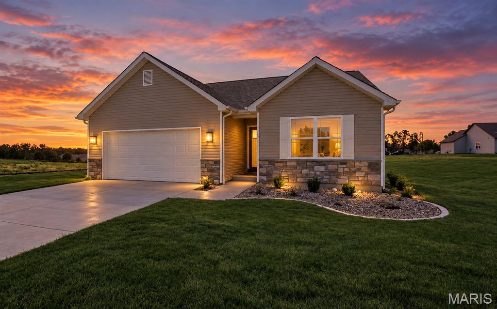 Welcome to this beautiful 3-bedroom, 2-bath ranch home in Westwood Farms! Designed with an open, inviting layout, this home features luxury vinyl plank flooring throughout the kitchen, dining room, living room, hallway, and both bathrooms. The spacious kitchen features quartz countertops and flows seamlessly into the dining area and vaulted great room—perfect for everyday living and entertaining.

The primary suite offers a comfortable retreat, while two additional bedrooms provide flexibility for family, guests, or a home office. The home is built on a lookout basement foundation with rough-in plumbing already in place for future basement finishes. The basement also features a gas furnace and a 50-gallon hot water heater, providing a great foundation for creating additional living space in the future.

Enjoy impressive curb appeal with a beautiful stone front elevation, oversized garage, and a fully sodded yard complemented by a professional landscaping package.

Westwood Farms offers convenient access to everyday amenities, with Walmart, Aldi, Applebee’s, gas stations, and other local shopping all within walking distance. With quality finishes, a functional open floor plan, lookout basement, and convenient location, this home offers an excellent opportunity to enjoy comfortable new-construction living in Warrenton.
