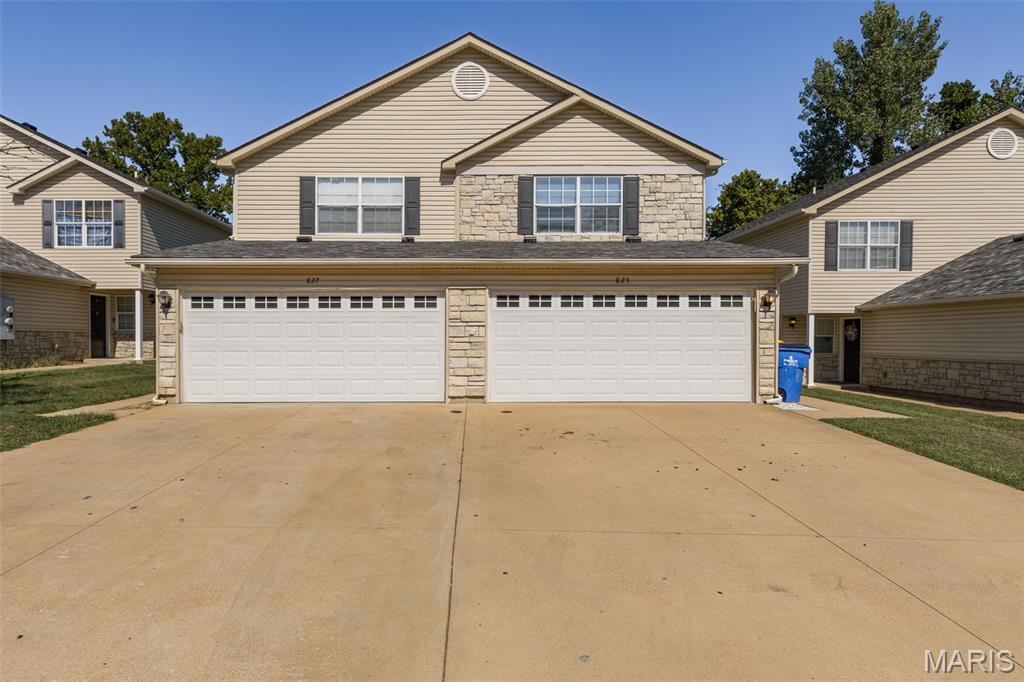 BE PREPARED TO FALL IN LOVE WITH 827 WOODSIDE CREEK!  Modern updates, a functional layout, and a desirable Festus location come together in this stunning 3-bedroom, 2.5-bath townhouse. Featuring new flooring throughout, fresh contemporary finishes, and a beautifully updated kitchen with stainless steel appliances, custom-style cabinetry, sleek countertops, and designer fixtures, this home offers the look and feel today's buyers are searching for.
The open main level creates a seamless flow between the kitchen, dining, and living spaces, while expansive windows and sliding glass doors bring in an abundance of natural light. Step outside to enjoy a private patio and tranquil wooded backdrop, perfect for morning coffee or evening relaxation. Complete with a spacious primary suite, attached 2-car garage, and low-maintenance exterior living, this move-in ready property combines comfort, convenience, and style in one exceptional package.