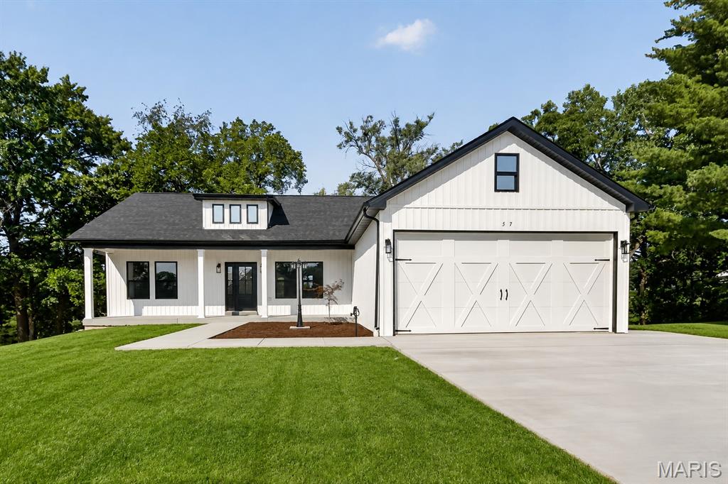 Brand-new ranch home offering abundant natural light, neutral colors, and a desirable split-bedroom floor plan. This thoughtfully designed home features 3 bedrooms, 2.5 bathrooms, a full walkout basement, and a 2-car attached garage. The functional layout provides excellent flow from the garage entry, leading into the laundry room, which connects to the primary suite's walk-in closet. The spacious primary bathroom features dual vanities, a relaxing soaker tub, and a separate shower before flowing into the primary bedroom. The kitchen is beautifully appointed with white cabinetry, including select 42-inch upper cabinets with crown molding, granite countertops, and ample storage space. Throughout the main level, you'll find attractive 9-foot ceilings that enhance the open and airy feel. The full walkout basement features a 9-foot pour, rough-in plumbing for a future bathroom, and a sump pump, providing excellent potential for additional finished living space. Step outside to enjoy the low-maintenance Trex deck overlooking the backyard.