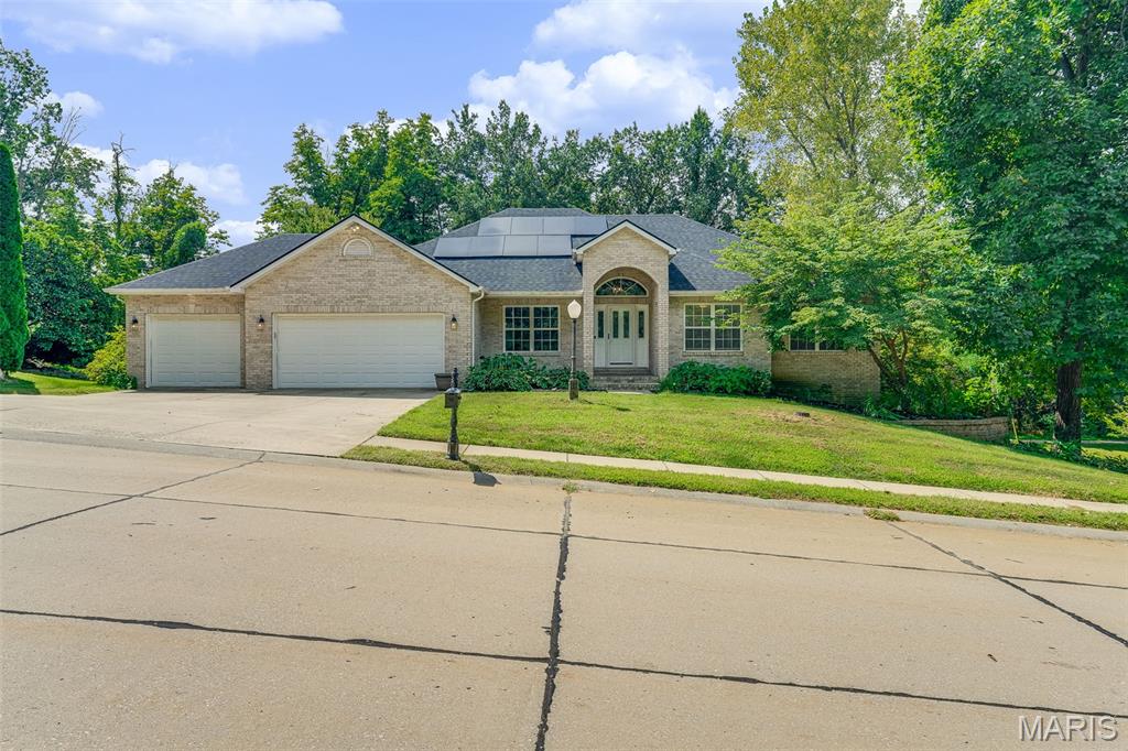 Welcome home to this spacious 5-bedroom, 3-bath ranch offering a thoughtfully designed layout, valuable updates, and plenty of room to spread out. The main living area features a vaulted ceiling, creating an open and inviting feel, while a formal separate dining room provides the perfect space for gatherings and special occasions.

The kitchen offers plenty of functionality with a center island for additional prep space and seating. Convenient main-floor laundry makes everyday living even easier. The spacious primary suite includes a private en-suite bathroom, creating a comfortable retreat.

The main level features upgraded limestone core flooring with a lifetime warranty, combining durability with a beautiful finish. Step outside to enjoy the enclosed upper deck, offering a great space to relax or entertain, while the covered lower patio provides even more outdoor living space just off the finished walk-out basement.

The finished walk-out lower level adds generous additional living and entertaining space and contributes to the home's flexible 5-bedroom, 3-bath layout.

Major updates include a water heater replaced in 2023 and a new roof and solar panels installed in 2024. All appliances were purchased in 2023 and are energy efficient, and the home is also equipped with a water softener system. The septic tank was professionally pumped in March 2026. As an added benefit, the seller will pay off the solar panels prior to closing.

The seller will also provide a detailed binder containing maintenance records, warranties, and helpful information regarding the flooring, cabinets, blinds, septic system, appliances, fireplaces, roof, solar panels, and more.

With its spacious layout, finished walk-out basement, multiple outdoor living areas, energy-efficient improvements, and extensive documentation, this home has been thoughtfully maintained and is ready for its next owner. Schedule your private showing today!

Buyer to independently verify all MLS information, including but not limited to square footage, room measurements, lot size, taxes, and school district.