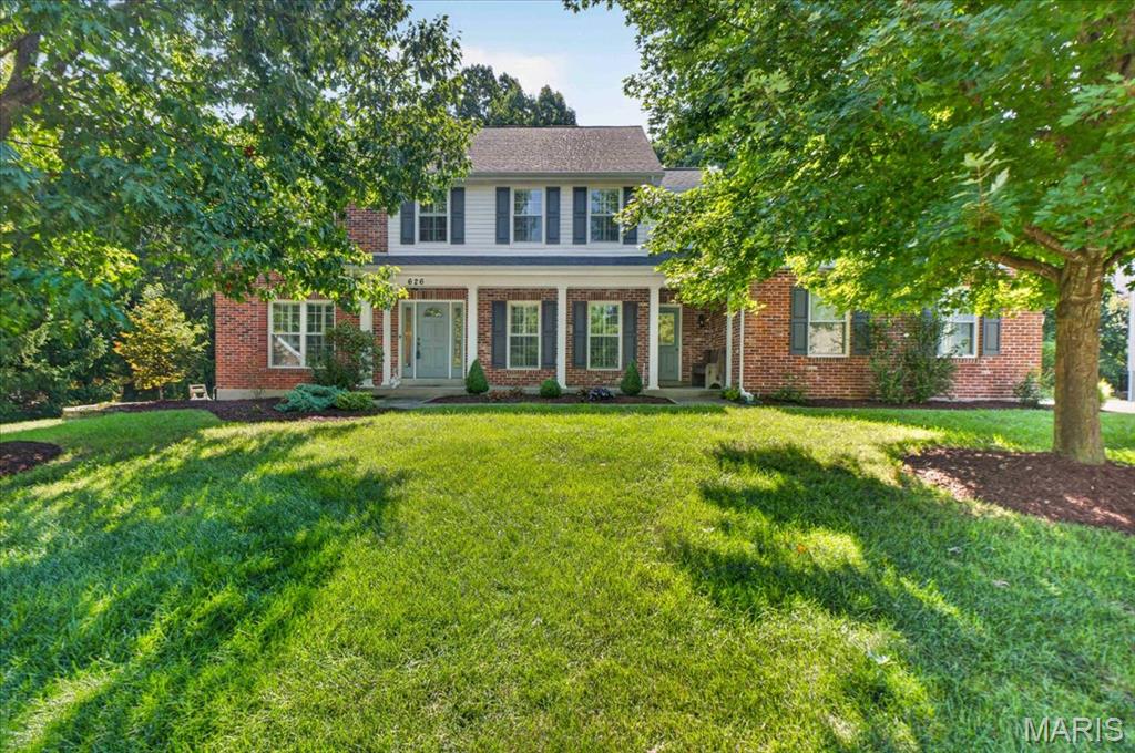 Welcome to this beautiful two-story Dartmouth home, tucked away on a quiet cul-de-sac and backing to mature trees. Conveniently located near Lafayette High School, this home offers generous living spaces, timeless details, and a floor plan designed for both everyday living and entertaining. The welcoming 2-story foyer features hardwood flooring and cased openings leading to the formal living room, which offers plantation shutters and built-in shelving and could easily serve as a home office or quiet retreat. The adjacent dining room adds an elegant touch with hardwood floors, crown molding, chair rail, and plantation shutters. At the heart of the home, the spacious great room invites everyone to gather around the wood-burning fireplace, with hardwood floors, a bay window and crown molding adding warmth and character. The beautifully appointed kitchen is designed to keep everyone connected, flowing naturally into the breakfast area and great room. Granite countertops, tile backsplash, 42" cherry cabinetry, center island, gas cooktop, double ovens and abundant storage make the kitchen as functional as it is inviting. The breakfast area offers a bright spot for morning coffee or casual meals, while sliding doors lead to the large deck and private, tree-lined backyard. Upstairs, the spacious primary suite offers vaulted ceilings, plantation shutters, generous walk-in closets and a beautifully appointed bath with dual sinks, oversized tub and custom-tiled walk-in shower. Three additional bedrooms, a Jack-and-Jill bath and convenient private full bath complete the second floor. The finished walk-out lower level adds even more room to spread out, with a large family room, game room with dry bar and beverage refrigerator, additional bedroom and full bath. Whether hosting game night, relaxing with family or accommodating guests, this level offers incredible flexibility. A three-car side-entry garage, 9' main-level ceilings, sprinkler system, newer upstairs carpet, and large deck are just a few of the additional highlights. Beautifully maintained and thoughtfully designed, this home offers the space, setting, and versatility you've been looking for.