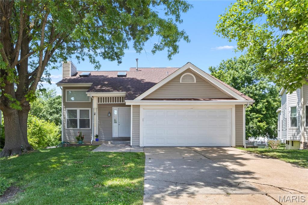 A rare find at this price point, with the yard, deck, layout, and flexible space buyers are hoping for. This 3-bedroom, 2-bath home offers an exceptionally generous fenced backyard and a huge deck that make outdoor living the standout feature, with room to entertain, garden, play, let pets run, or simply enjoy extra breathing room. Inside, the layout adds practical appeal with a main-floor primary bedroom and full bath nearby, plus two additional bedrooms upstairs with a second full bath featuring an updated shower. The main living area feels warm and comfortable with updated flooring, fresh paint, and a fireplace, while the kitchen and dining area connect easily to the deck and backyard. The partially finished walk-out lower level adds valuable flexibility for a rec room, home office, workout area, hobby space, or second hangout zone. With a 2-car attached garage, roof replaced in 2020, and a convenient location near shopping, dining, everyday amenities, and area schools, this home offers a compelling combination of value, space, and lifestyle.