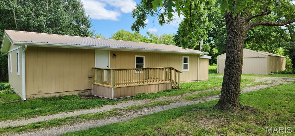 Situated on 3 beautiful acres, this unique property offers two homes and a spacious 25x50 metal shop, making it perfect for multi-generational living, rental income potential, or anyone needing extra space. The primary residence features 3 bedrooms and 2 bathrooms and has been recently remodeled, offering comfortable, move-in-ready living with updates throughout. The second home is full of potential and just needs a little TLC to become a guest house, rental property, or additional living space. Surrounded by mature trees and open yard space, the property provides a peaceful country setting with plenty of room for gardening, hobby farming, animals. Opportunities like this don’t come along often—whether you’re looking for an investment, family compound, or country retreat, this versatile property offers endless possibilities. Schedule your private showing today!