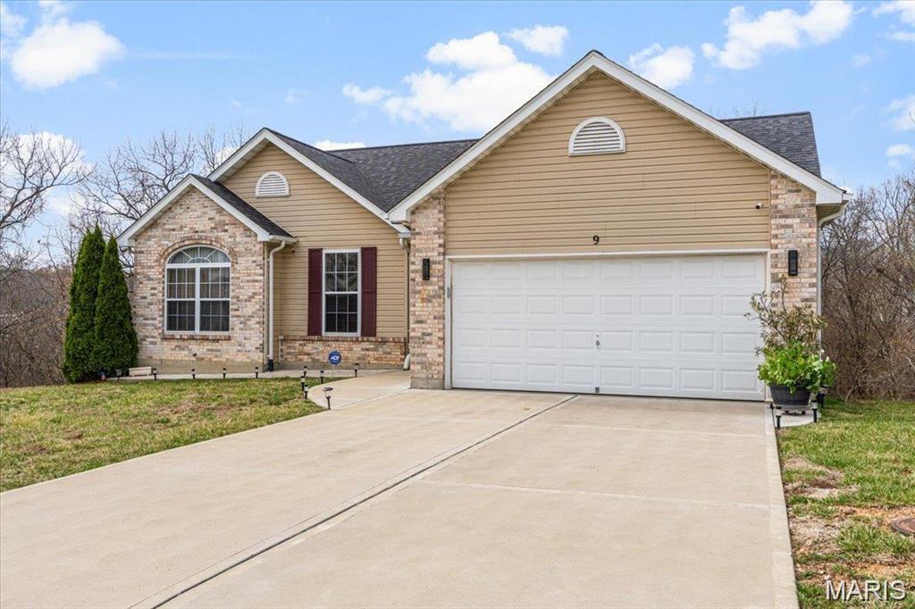 This beautifully updated 3-bedroom, 2-bath ranch home offers over 1,300 sq. ft. of stylish and comfortable living space. With vaulted ceilings in the kitchen, family room, dining room, and entry foyer, this home feels open and inviting.  The brand-new kitchen is a chef’s dream, featuring quartz countertops, custom cabinetry, stainless steel appliances, center island, and vaulted ceilings that enhance its spacious feel. The open floor plan flows seamlessly into the family room and dining area, both boasting gorgeous wood floors that continue throughout the main level. The primary suite is a true retreat, and two additional bedrooms are spacious and share an updated hall bath with modern fixtures. Step outside onto the covered deck where you can relax and enjoy the outdoors in comfort. The walk-out lower level provides endless possibilities.  With top-to-bottom updates, vaulted ceilings, and rich wood flooring, this home is a rare find!