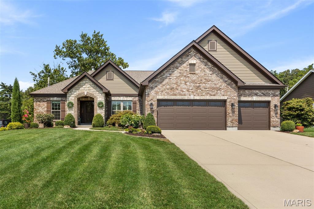 Built in 2019, this beautifully designed ranch offers thoughtful finishes, generously sized rooms, and a beautifully landscaped setting with great outdoor living, making every day feel luxurious and entertaining easy. Soaring ceilings and an open floor plan create a warm, inviting atmosphere. The kitchen features a large center island, breakfast area, separate dining room, abundant cabinetry, and generous workspace. The adjoining living room showcases a striking stone fireplace, gorgeous custom walnut cabinetry and mantel just added in August 2026, and floor-to-ceiling picture windows overlooking the landscaped yard and outdoor fireplace. The primary suite features a vaulted bedroom ceiling and spa-inspired bath with soaking tub, separate shower, dual vanities, and walk-in closet. Two additional bedrooms, a full bath, main-level laundry, and a mudroom with custom built-ins complete the first floor, along with a convenient built-in hall desk. The oversized screened porch off the kitchen is a standout, featuring stone flooring and a ceiling fan. Just outside on the patio, a beautiful stone fireplace with a gas insert creates an inviting space for relaxing while overlooking the spacious backyard. Professionally designed landscaping surrounds the home. The finished lower level adds a fourth bedroom with egress window, full bath, spacious recreation room, and ample storage and hobby space. A three-car garage completes the home, offering additional convenience and flexibility.