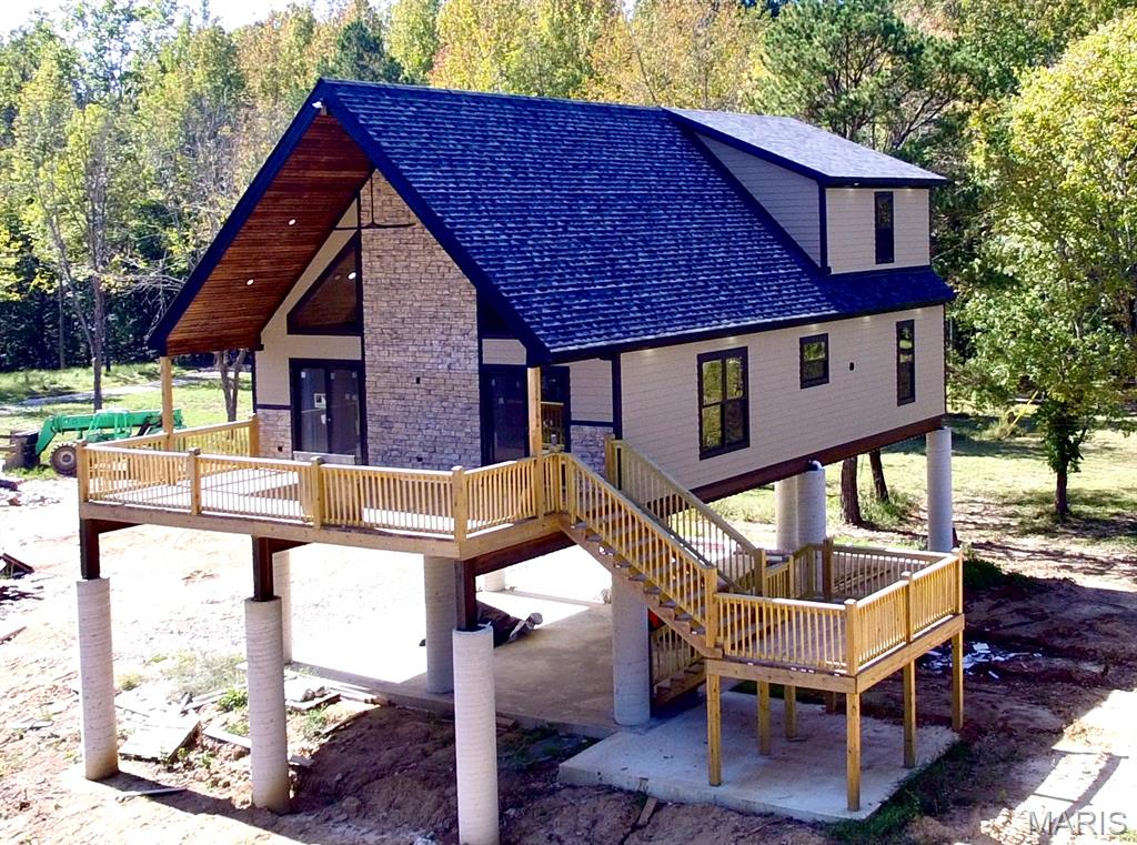Welcome to your dream escape on the river! This brand-new 4-bedroom, 3-bathroom cabin offers the perfect mix of rustic elegance and modern luxury, all set on a private stretch of riverfront.
Step inside and be amazed by the soaring vaulted ceilings, anchored by a 30-foot cedar tree centerpiece in the living room—a one-of-a-kind architectural feature that brings the outdoors in. The great room is framed with expansive windows that flood the space with natural light and offer serene river views. The open-concept layout flows into a stunning kitchen adorned with granite countertops throughout, premium cabinetry, and modern fixtures, perfect for entertaining family and friends.
Retreat to the spa-like bathrooms featuring walk-in tiled showers, high-end finishes, and ample storage. The loft area overlooks the main living space, providing additional room for relaxation or hosting guests.
