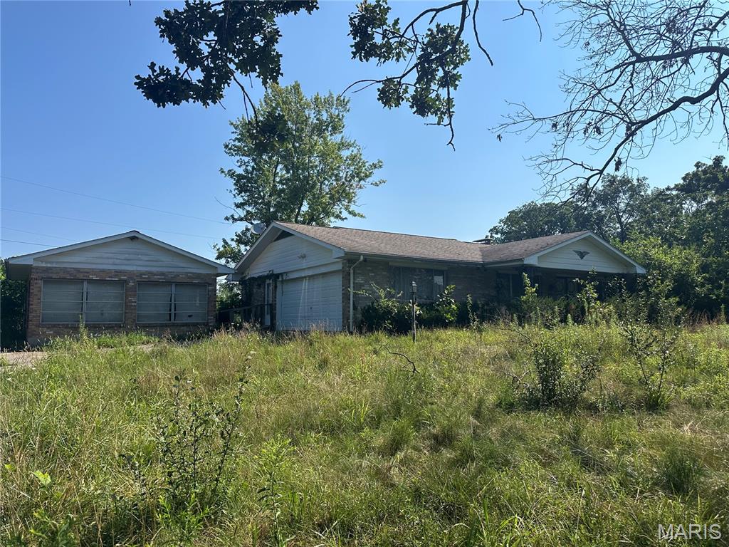 This Home Needs Work! Brick Ranch with 3 Beds and 2 Baths. Full Unfinished Basement & 2 Car Garage. Detached Sunroom. It has been vacant for several years and has been vandalized and a fire in the basement. No utilities on and most wiring and plumbing have been removed. Ready for Someone to Renovate it and Bring it Back to Life!