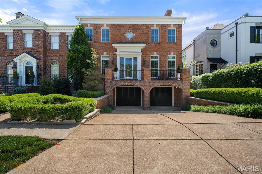 166 N Central is a stunning traditional-style home in historic Old Town Clayton offering over 4,500 square feet of beautifully updated living space. Flooded with natural light from countless windows throughout, this exceptional residence features 3 large bedrooms, 4 full baths, and 1 half bath with an ideal layout designed for both comfortable everyday living and effortless entertaining.
This home has inviting gathering spaces that showcase classic architectural details, refined finishes, and a warm, welcoming atmosphere.  The elegant foyer is flanked by an inviting living area with a fireplace and a tastefully designed dining room. The beautifully updated eat-in kitchen opens to the backyard sanctuary. The upper level includes all three spacious en-suite bedrooms, creating a private retreat away from the main living areas, and a convenient laundry room. The walk-out lower level offers incredible additional living space with a large family room, full bath, and extensive storage options. An oversized 2-car garage provides even more convenience and storage.
Step outside to your own private backyard oasis featuring a deck, patio, and lush mature landscaping, creating the perfect setting for relaxing, entertaining, or enjoying peaceful outdoor living. This impeccably maintained home combines sophistication, space, and comfort in an exceptional setting.