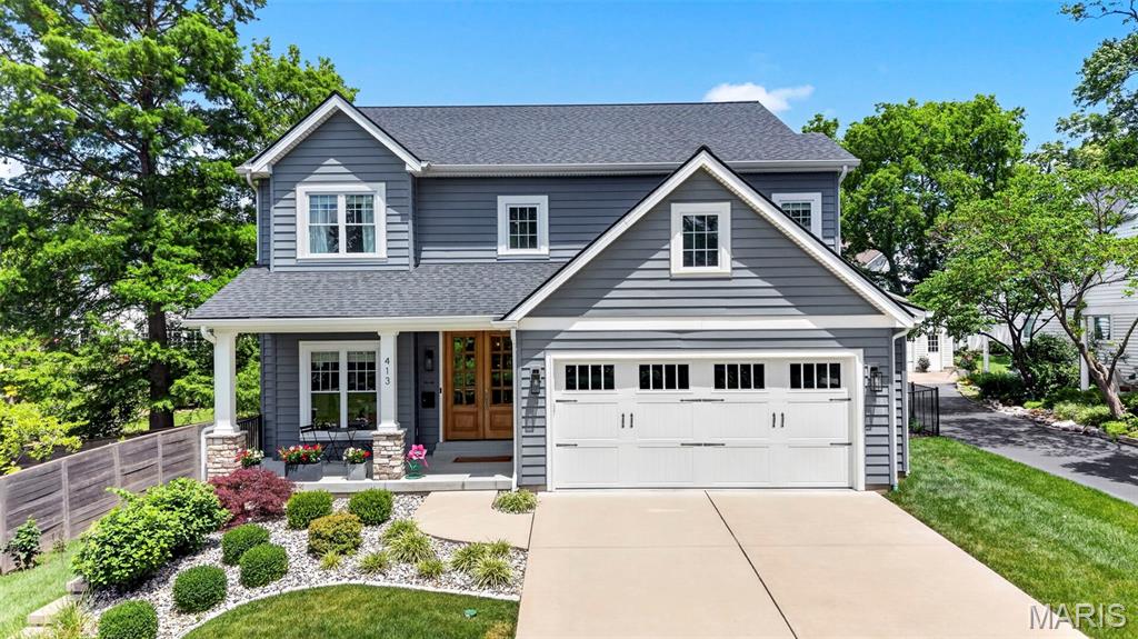 Welcome Home! Experience the best of the Kirkwood lifestyle at 413 E. Madison, a custom-built luxury residence ideally situated on one of Kirkwood's coveted streets. Imagine starting your mornings with coffee by the fireplace on your private owner's deck, strolling to the Farmers' Market on weekends, and ending the day gathered with family and friends around the pool and outdoor living spaces. Designed for both everyday living and effortless entertaining, this light-filled home showcases a warm contemporary aesthetic, white oak flooring, and an open-concept layout that seamlessly connects the main living areas. The chef's kitchen features quartz countertops, a large center island, stainless steel appliances, and a butler's pantry, all opening to the spacious great room and dining area. Upstairs, the luxurious primary suite serves as a private retreat with a spa-inspired bath, oversized walk-in closet, and exclusive access to a composite deck with a stone fireplace. Three additional bedrooms, including a Jack-and-Jill suite and private en-suite bedroom, offer exceptional flexibility for family and guests. The finished lower level expands the living space with a recreation room, wet bar, wine cellar, den, bedroom, and full bath. Outside, your private backyard oasis awaits with a resort-style pool, expansive patio, and covered outdoor living area with a stone fireplace. Just blocks from Downtown Kirkwood's restaurants, boutiques, parks, and community events, this exceptional residence offers over 4,700 square feet of thoughtfully designed living space where luxury, convenience, and lifestyle come together.