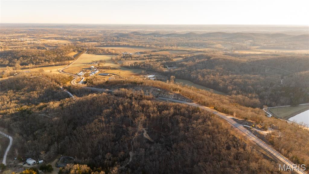 When you think of privacy, seclusion, and potential, this is the kind of place that comes to mind. This rare double-lot oasis, (Lots 9 & 10), spans 11.34 acres and is surrounded by breathtaking views that will stop you in your tracks, nestled in the rolling hills of Marthasville.

The groundwork has already been started by the current owners — all that’s left is for you to finish the vision and build your dream home at the highest point of the property. Spend your summer days exploring and swimming in the creek, then unwind in the evenings as you listen to the gentle flow of water feeding into the shared pond.

Complete with soil tests and a survey, this property is truly ready for what comes next. All that’s missing is seeing it in person to fully appreciate the future it holds. Schedule your private showing with Daniel today before this opportunity slips away.