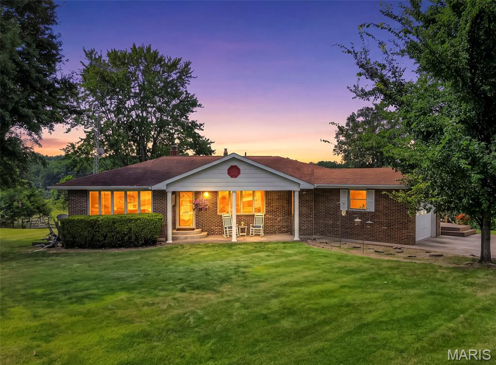 All Brick Walk-out Ranch home of 14+/- parklike acres just outside of Bowling Green, Missouri! This home has been well maintained and it's ready for a new owner to enjoy the beautiful views and quiet country tranquility, just 5 minutes from all the conveniences that Bowling Green has to offer! This gently rolling 14+/- acres has a great mix of open and woods, a small creek and excellent pasture for grazing some horses, a steer for the freezer, or whatever your heart desires! Just a half mile south of Hwy 54 and about 3 miles east of Bowling green, this property is easy to get to and still has that "middle of nowhere" country vibe! The house has a full masonry, woodburning fireplace in the family room in the basement, that walks out to a level backyard. The home has Anderson Windows and so much more.  The huge deck is great for soaking in the views or just relaxing while you grill your favorites! The metal outbuilding has a lean-to with plenty of room for all your equipment and "toys"! All Kitchen appliances are included as well as the Washer and Dryer! Come and see this wonderful place to live!