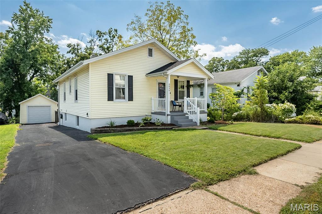 **PRICE IMPROVEMENT **OPEN HOUSE SAT 9/12 NOON - 2PM** Completely updated and move-in ready, this home is nestled in the heart of Brentwood! It has over 1,900 sq ft of living-4 bedrooms, 2 full baths, finished walkout LL & oversize garage! It blends timeless character with thoughtful modern updates, maximizing space and storage in every room. Attractive curb appeal with recently updated landscaping, less than a year old roof, resurfaced large driveway, and a spacious front porch to enjoy life’s slower moments.

You'll enter to a spacious living/dining room with gleaming Bamboo wood floors, crown moldings, 9 ft ceilings, and abundant natural light. The recently updated kitchen has granite countertops, glass backsplash, painted cabinetry w/ crown, stainless steel appliances & additional storage added. The main bedroom displays an oversized king bed with ease and has a large walk-in closet w/ custom organizers! Two additional large bedrooms complete the main level, as well as a full modernized bathroom with new vanity, lighting, and cabinetry. 

The finished LL offers a massive family room with big windows for great natural light and a fourth bedroom for additional flexible living plus a 2nd full updated bath! Walk out to a huge patio, covered porch & level yard w/ metal fencing for outdoor entertaining and play.

Ideally located within walking distance to prestigious and highly sought after Brentwood schools and just minutes from all the restaurants, shopping, grocery stores, parks, and major highways you desire. This home offers the perfect combination of space, warmth, convenience, and functionality. Private showings beginning Wednesday September 9th.