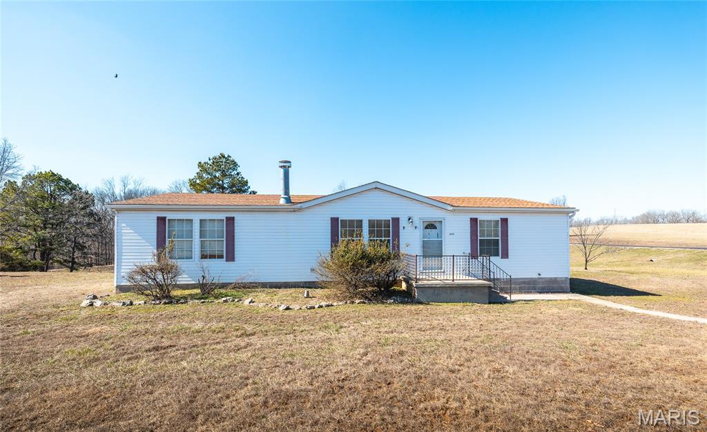 Enjoy affordable country living with this 3-bedroom, 2-bath manufactured home situated on 3 +/- scenic acres with access to a beautiful shared pond. Conveniently located just off State Highway 51, this property offers excellent access while still providing the peace of rural living. The spacious setting provides plenty of room to relax or enjoy outdoor activities, all while taking in the tranquil surroundings. Whether you’re looking for a comfortable full-time residence or a peaceful retreat, this property offers the perfect blend of convenience, space, and value.