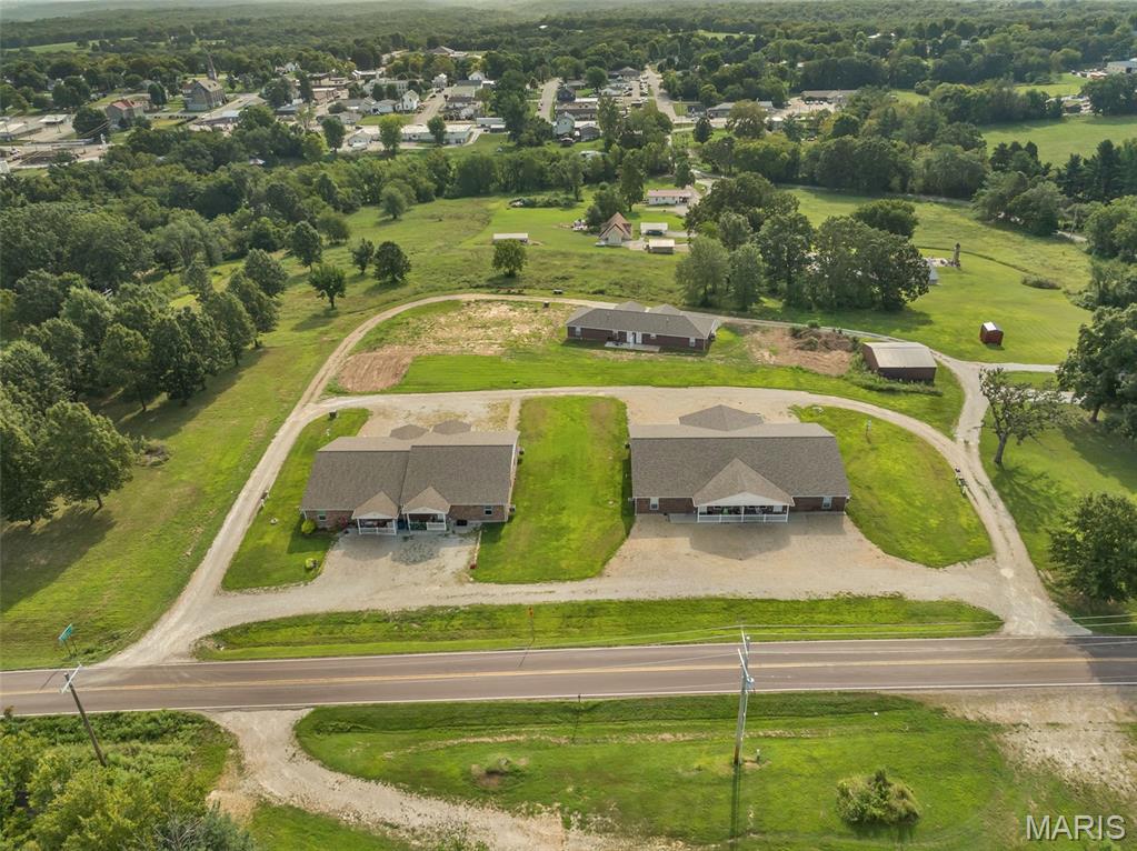Outstanding income-producing multi-family investment opportunity in Vienna, Missouri! Situated on approximately 2.29 acres, this property features two 4-plexes and one duplex for a total of 10 units, currently 100% occupied, with rent potential of approximately $10,000 per month. Infrastructure is already in place to begin an additional duplex, with room for further expansion if desired.

Built with attractive brick exteriors and modern interior finishes, every unit offers 2 bedrooms, 2 full bathrooms, an open floor plan, and an in-unit washer and dryer—features that help make these rentals highly desirable to today's tenants.

The property is conveniently located near several major Mid-Missouri employers, including Quaker Windows & Doors, Diamond Pet Foods, and the Hippos cultivation/production facility, providing access to a strong employment base and continued housing demand.

With full occupancy, strong income potential, quality construction, and built-in opportunities for additional development, this property offers an investor the rare combination of immediate income and long-term growth potential.