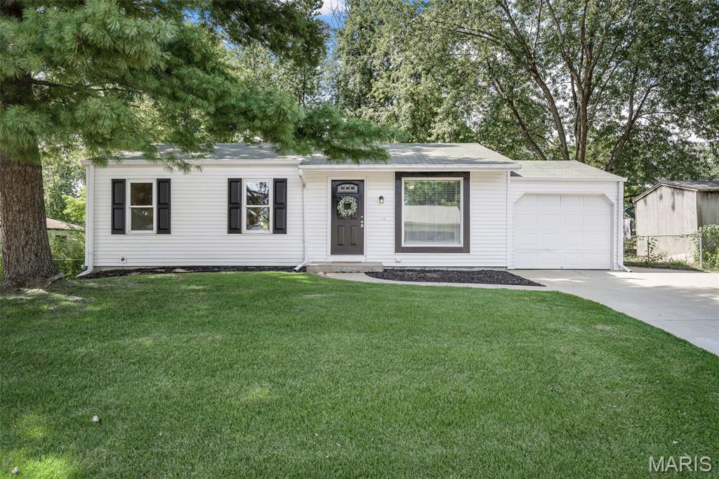 This DARLING, UPDATED, MOVE-IN READY ranch home is waiting for it's new homeowners!  Located in the heart of O'Fallon, MO, 504 Woodcrest Blvd has been lovingly updated over the last few months. Beautiful & clean curb appeal welcome you with white siding, new mailbox, new mulched landscaping beds, new black shutters, matching front door & trim, an oversized 1 car garage with a 2 car extended driveway! Lots of parking space here!

Inside you'll find 3 bedrooms, 1 full bath and 1400 sq ft of total living space with the *partially finished* basement.  Enter this quaint home to find fresh, neutral paint & brand new carpeting throughout the entire home creating a calm & airy feel.  The cozy living room is flooded with natural light with the large picture window on the front of the home.   The eat-in kitchen provides a generous dining space, white cabinets, ceramic tile floor, new light fixtures, stainless steel appliances, a pantry, & a sliding glass door leading to your OVERSIZED patio which is perfect for outdoor entertaining or relaxing.  Let the kids & dogs roam and play in the large, level, & fully fenced backyard!

The primary bedroom has his & hers closets providing plenty of storage space. 2 additional bedrooms can serve as such OR be used as an office or playroom.  The full bath has brand new flooring, a reglazed tub & a new light fixture.  Head downstairs to the *partially finished* basement which has been freshly painted & is clean, nice & bright with newly installed recessed lighting & white beadboard paneling. A professional radon mitigation system is also installed for your preventative health & security.

Other updates include: Brand new sliding door (being installed in August 2026), Brand new picture window in living room (being installed in August 2026)

Don't miss this opportunity to own an affordable home in O'Fallon with top-rated schools & conveniently located near shopping, dining, parks, & more!

Check back on or before Thursday, 7/23 for professional pictures and a walk-through video tour!