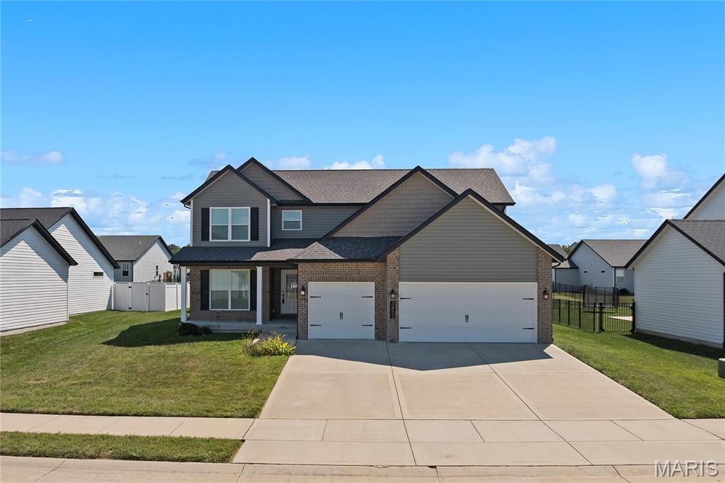 Better than new! This beautiful 1.5-story Cypress floor plan has everything you’ve been looking for — and then some! From the moment you enter in, you’ll love the warm, welcoming feel of the hardwood floors that flow through the foyer, dining room, kitchen, breakfast nook and living room. The main-floor primary suite is spacious and inviting, with a beautiful bath featuring a double vanity, separate shower and tub. You’ll also love the convenience of main-floor laundry and a powder room just off the living room. And that dining room? It’s so versatile! Use it as a traditional dining space, home office, playroom, sitting room or whatever works best for your lifestyle. Upstairs, there are 3 generous bedrooms, each with its own walk-in closet, plus a full bath, extra storage and even a  desk area. Head downstairs to the finished lower level and you’ll find even more space to enjoy, including a large family/rec room, 5th bedroom, 3rd full bath and tons of storage. The main living spaces are simply open and inviting, with warm cabinetry, beautiful hardwood floors and an electric fireplace that makes you want to curl up and stay awhile. Outside, you’ve got covered front and back porches, a fully fenced yard and a 3-car garage with plenty of room for cars, toys, hobbies and all the extras. All this and an amazing location- you’re close to everything — shopping, restaurants, parks,  entertainment and major roadways — making it easy to get where you need to go while still enjoying a wonderful place to call home. This home has been lovingly cared for and it shows. The floor plan is amazing, the space is incredibly versatile and there’s room to spread out. It has all the comfort and charm you want, without feeling like you have to compromise on anything. Come see it, fall in love and get ready to say… HOME SWEET HOME! Professional photos coming 9/4