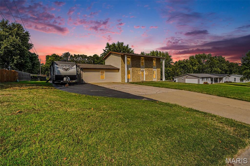 Anyone looking for a unicorn? This property is in the middle of St. Peters, almost an acre, unincorporated and has NO HOA! Freedom alongside convenience is finally available! As you walk around outside, a sizeable front yard sets the home back from street traffic - there's room to park a 5th-wheel camper AND the truck in the driveway! When not in use, don't worry about storing that camper or boat somewhere else - the driveway extends down the property line and hosts an impressive 11'x40' carport for your big-kid toys! Behind the house - a massive, park-like backyard beckons you to frolic, then cool off in the 27' pool or lounge on the large deck with privacy screen! There is even a 10'x12' utility shed to easily store yard tools, pool equipment and anything else for the off-season. Inside there are more joyful surprises! A brand-new front door, new LVP flooring on the main level, beautifully refinished original hardwood throughout the second floor and lighted ceiling fans in every bedroom, dual closets in the primary bedroom, renovated bathrooms, an incredible rec room just off the sizeable kitchen with TONS of cabinets, new epoxy counters that include a wraparound breakfast bar and newer stainless steel appliances, a separate dining room, another bonus space with French doors (home office, music room, play room or library?),  fresh paint throughout and a blank slate in the basement for you to personalize.  ALL appliances stay, even the fridge, washer & dryer! This one is an absolute dream of a wish list with every item checked! Come imagine your life in this oasis - without an hour-long commute!