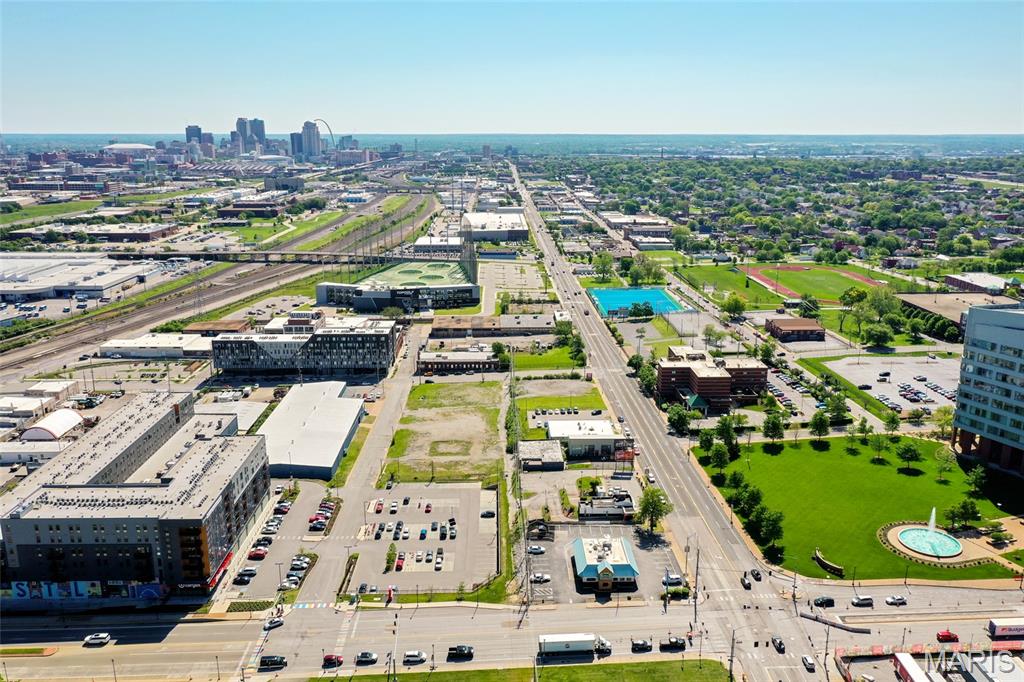 Rare urban development opportunity in the heart of Midtown St. Louis — 2 acres of investment-grade land positioned at the gateway to the city's newest and fastest-growing district, Prospect Yards. The Steelcote Prospect Yards Assemblage comprises two non-contiguous parcels totaling approximately 2.00 acres (+/-87,120 SF) in City Block 2213: a +/-1.50-acre rectangular parcel fronting Papin Street (the hotel site) and a +/-0.50-acre Chouteau Avenue frontage parcel (the QSR/retail site), with Theresa Avenue providing secondary access on the eastern boundary.
The subject site sits at the epicenter of over $2.8 billion in new construction activity that has transformed Midtown over the last decade. The seller, Pier Property Group, developed the award-winning Steelcote Square campus immediately adjacent — three phases of residential mixed-use totaling 153 units across Steelcote Lofts, Steelcote Crossing, and the ground-up Steelcote Flats (158,000 SF, completed 2022). National retailers Target (70,000 SF) and Topgolf anchor the immediate block. SSM Health's $550 million SLU Hospital and the under-construction Cardinal Glennon Children's Hospital sit directly across Chouteau Avenue — the single strongest demand driver for the proposed hotel use. Saint Louis University's North and South campuses flank the corridor, generating sustained hospitality and retail demand from 15,000+ students, faculty, patients, and medical visitors daily.
Architectural concept plans (Arcturis, January 2025) have been prepared depicting a 4-story, 100-key hotel with +/-100 surface parking spaces on the Papin parcel, and a 1-story commercial/QSR building (+/-2,500-7,500 SF) with drive-thru capability on the Chouteau frontage parcel. Current zoning is J-Industrial; rezoning will be required for hotel and/or retail uses. The site carries eligibility for Chapter 353 tax abatement through the St. Louis Midtown Redevelopment Corporation (SLMRC) — potentially providing up to 20 years of real estate tax abatement on improvements, a compelling economic incentive for any developer underwriting construction costs in the current environment.
The parcels may be purchased together as a single +/-2.00 AC assemblage at $2,750,000, or separately: the North Parcel (Papin) at $2,000,000 and the South Parcel (Chouteau) at $750,000. All-cash, 1031 exchange, or assumable mortgage structures will be considered.