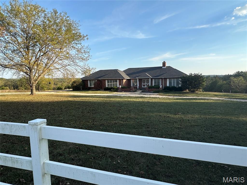 EMBRACE YOURSELF WITH THIS RARE FIND…Just 30 minutes from Rolla. 140 acres with 1+  mile of Bourbeuse River frontage. The property has a blend of natural beauty and outdoor recreation, ideal for hunting enthusiasts, nature lovers, or anyone seeking a peaceful retreat relaxing by the river or the ponds. The 5- plus bedroom 5-bath home boasts soaring vaulted ceilings and sprawling living areas, along with an expansive deck and patio ideal for grilling, entertaining, or simply taking in the breathtaking views and abundant wildlife. The property includes an 84’ x 36’ pole barn with a 15’ x 48’ attachment, plus a 36’ x 50’ barn with a 15’ x 50’ attachment, providing ample space for  machinery and equipment, livestock, or hobbies. For added convenience, a 1,440 sq. ft. guest quarters features 3 bedrooms and 1 bath, perfect for extended family, visitors, or caretakers. With fencing already in place and acres of mature timber to explore, this property is well-suited as a working farm, private retreat, or a peaceful getaway to escape it all and relax.