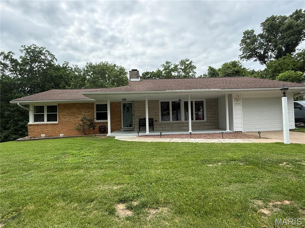 Nestled on a rare 0.844-acre lot in Cape Girardeau and located within the highly sought-after Alma Schrader Elementary School district, this spacious 3-bedroom, 2-bath home offers the perfect combination of charm, updates, and versatility. Built in 1955 and offering approximately 1,943 finished square feet between the main level and partially finished walk-out lower level, this property provides room to spread out both inside and out. The lower level features a sleeping area, full bathroom, and flexible living space that can adapt to your lifestyle needs. Recent updates include freshly painted kitchen cabinets and a freshly painted exterior, giving the home a refreshed and inviting appearance. Enjoy relaxing mornings and peaceful evenings in the 3-season porch or sitting on the deck overlooking the fenced backyard, complete with mature trees that provide shade, privacy, and natural beauty. Need extra space for hobbies, projects, storage, or vehicles? The additional detached building offers endless possibilities as a workshop, garage, or recreational space. Properties with nearly an acre of land, mature trees, a fenced yard, and a desirable Cape Girardeau location don't come along often. Conveniently located near schools, shopping, dining, healthcare, and everyday amenities, this property offers the space, flexibility, and location today's buyers are seeking. Schedule your private tour and discover all that 1525 Kurre Lane has to offer!