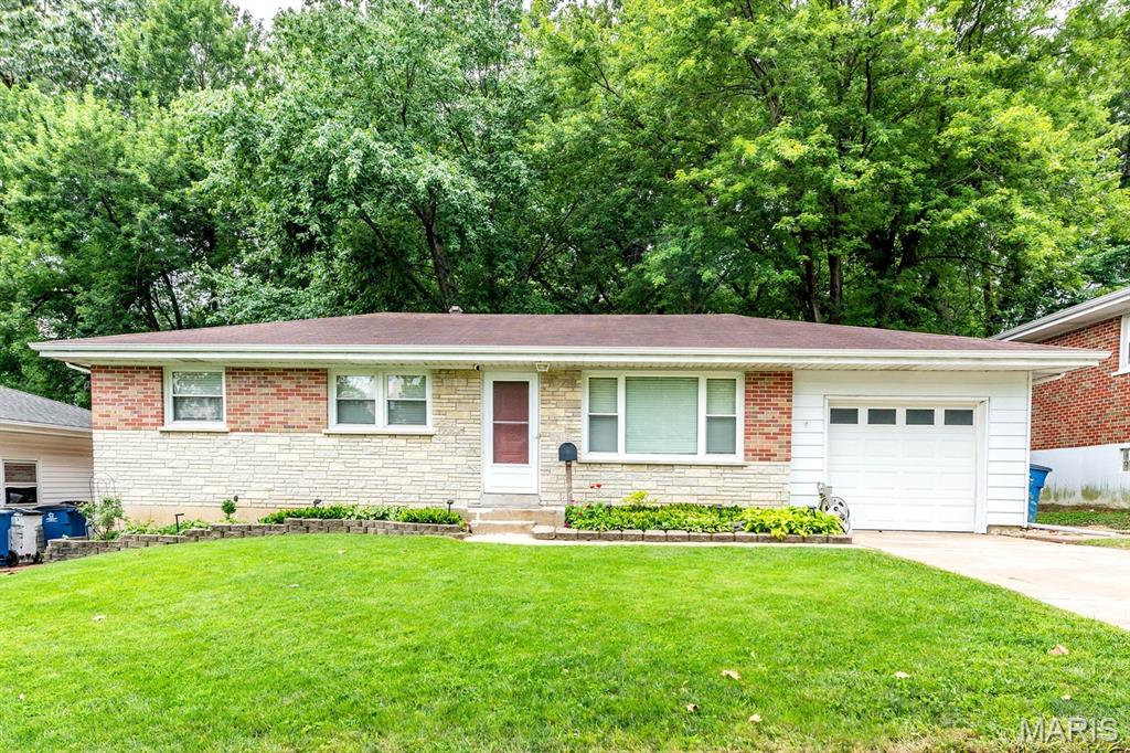 Welcome home to this beautifully maintained property that offers the perfect blend of comfort, updates, and value. Nestled on a lot with a private, tree-lined backyard, you'll love relaxing or entertaining on the spacious deck overlooking the serene outdoor setting. Inside, gleaming wood floors flow throughout much of the home, while numerous updates provide peace of mind and modern convenience. The remodeled kitchen features attractive cabinetry with glass-front accents, updated appliances, and abundant storage, creating a stylish and functional space for everyday living. Additional improvements include thermal-pane windows, added attic insulation, updated electrical service, a newer garage door and opener, updated bathroom vanity and shower surround, closet organizers, ceiling fans, and refreshed landscaping. The finished lower level expands your living space with a fantastic recreation area complete with a custom bar—perfect for game days, gatherings, and entertaining guests. Additional finsihed room flexibility for a home office, or hobby space, or guest accommodations. Ample storage space and a convenient laundry area complete the lower level. Move-in ready and affordably priced, this home offers exceptional value for first-time buyers, downsizers, or anyone seeking a well-cared-for property with thoughtful updates and a great outdoor setting. Don't miss this opportunity!