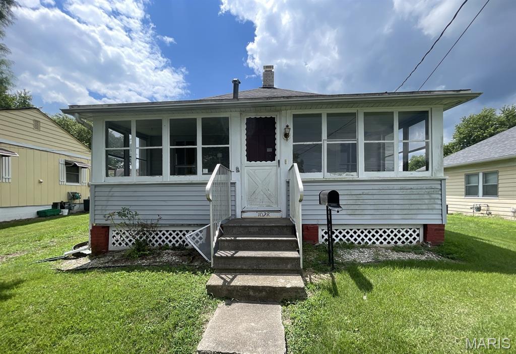 Opportunity awaits with this 2-bedroom, 1-bath home located on a residential street in Hillsboro. The main level features a functional layout beginning with a laundry/mudroom entry that flows into the kitchen, dining room, and living room, with both bedrooms and the full bathroom. A spacious enclosed front porch provides additional versatile space that can be enjoyed throughout much of the year. Additional features include an unfinished cellar basement and a detached two-car garage with both front and rear entry doors, offering added convenience for storage, hobbies, or parking. The property is being offered in its current condition and will require repairs and updates. Conveniently situated in Hillsboro, this home offers easy access to local parks, schools, shopping, dining, and community amenities, with nearby highways providing convenient travel to surrounding communities. With vision and renovation, this property presents an excellent opportunity to restore and customize a home to meet your needs. ALL information is deemed reliable but is not guaranteed and should be verified by the buyer and/or buyers agent before making an offer.