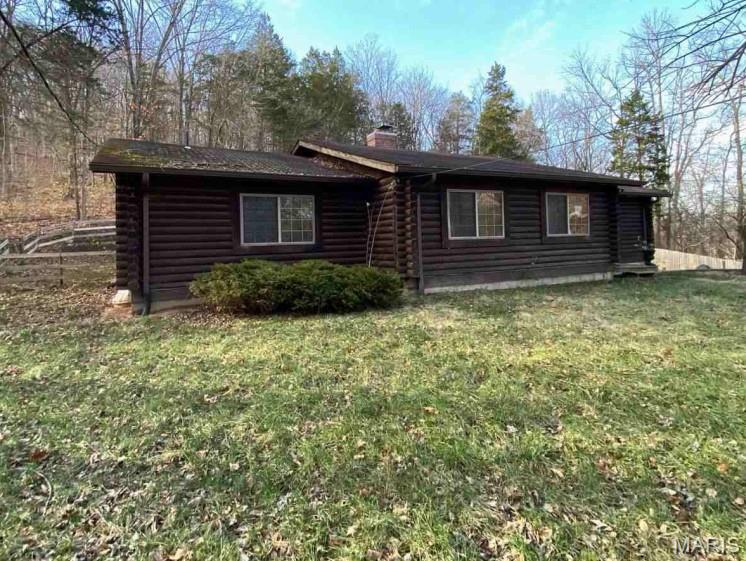 AUCTION Occupied - Great opportunity to own this log style home, built in 1986 and featuring 3 bedrooms, 2 baths. NO ACCESS, OR VIEWINGS of this property. Please DO NOT DISTURB the occupant. "As is" cash only sale with no contingencies or inspections. Buyer will be responsible for obtaining possession of the property upon closing. ***Please read all disclaimers before placing a bid***