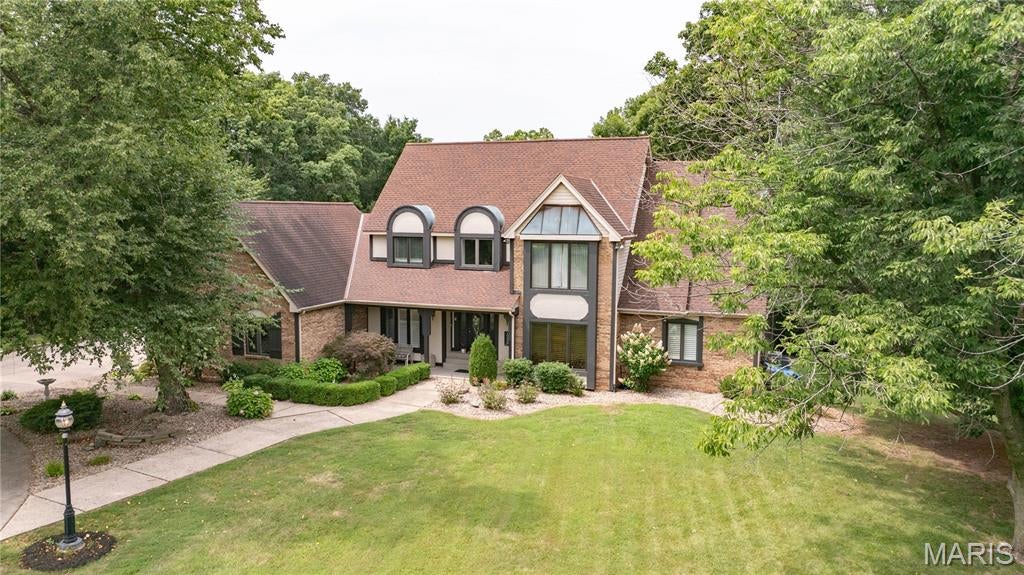 Welcome to your own private retreat! Nestled on 3 and a half picturesque acres with beautiful pond views, this impressive home offers the perfect blend of luxury, comfort, and space both inside and out. Thoughtfully updated and meticulously maintained, this property is designed for everyday living and unforgettable entertaining.

From the moment you arrive, you'll appreciate the home's inviting curb appeal featuring a covered front porch, concrete turn around driveway, and attached 3 car garage. Outdoor living takes center stage with an expansive paver patio, a large composite deck off the primary suite, and a 42' x 21' above-ground pool surrounded by composite decking, creating the ultimate backyard oasis. Recent improvements include a new pool liner and filtration system.

Step inside the dramatic 2 story foyer and discover a home filled with architectural details including soaring cathedral ceilings, skylights, crown molding, beamed ceilings, and abundant natural light. The spectacular great room features a floor-to-ceiling gas fireplace, and an open balcony overlook, creating a grand yet welcoming atmosphere.

The spacious kitchen is truly the heart of the home, offering updated finishes, solid surface countertops, a center island with breakfast bar, abundant cabinetry, pantry storage, and a seamless connection to the breakfast area and garage entrance. Just off the kitchen, the radiant sunroom features skylights, patio access, and a convenient pass-through to the kitchen, making it the perfect place to relax and enjoy views of the surrounding property. The formal dining room showcases elegant details including crown molding and a coffered ceiling, creating an ideal setting for holiday gatherings and special occasions.

Working from home is easy with a dedicated office/den complete with built in bookshelves. The main floor primary suite serves as a luxurious private retreat featuring deck access, a spacious walk in closet, and an updated spa like bathroom with double vanities, soaking tub, and separate shower. A second primary suite on the upper level provides exceptional flexibility for guests or multi generational living. 

The finished lower level significantly expands the living space and offers endless possibilities. Featuring a large family room with a wood-burning fireplace, a second full kitchen, recreation area, additional bedroom, bathroom, cedar closet, sauna, and abundant storage space, this level is perfectly suited for entertaining, extended family, or overnight guests.

Additional highlights include separate HVAC systems for the main and upper levels, a newer high efficiency air conditioning system, central vacuum, a floored attic with stairs and lighting, updated windows, skylights, plantation shutters, and numerous recent updates throughout the home.

Properties offering this combination of acreage, quality, updates, entertaining space, and scenic surroundings are exceptionally rare. Whether you're hosting family gatherings, enjoying the peaceful pond views, or simply relaxing in your private backyard retreat, this remarkable property delivers a lifestyle that's difficult to match.