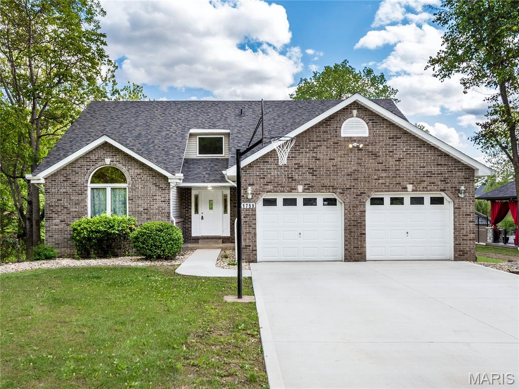 Are you looking for a home on Holiday Shores Lake tucked away in a private cove — away from the busyness of the main channel yet still offering full lake access — this one-owner, 1.5-story walk-out basement home is a must-see. New 2025 roof, HVAC, AC!  0.5 acre waterfront lot with 100 feet of shoreline with approx 5ft of deep water, this property features new riprap completed in 2026 and offers the perfect setting to enjoy lake life at its finest. 2,500 SF of living space with 3 bedrooms and 2.5 baths, including a main-floor primary suite complete with a whirlpool tub-separate shower. The eat-in kitchen offers a pantry, floating center island and flows beautifully into the bright and airy living spaces. The kitchen opens to a 12x20 deck with room to extend additional decking across the back of the home. The impressive two-story foyer leads to a vaulted living room and formal dining area — or expand the living space even further if formal dining isn’t needed. The walkout basement is studded with a full bathroom in place making it easy for the next owner to finish the space and customize it to fit their own style. Walk out to your backyard, hop on your boat, Wave Runner, or paddleboard and start enjoying everything lake life has to offer. As part of the Holiday Shores Association, you’ll also enjoy access to common grounds, parks, picnic areas, clubhouse, tennis courts, basketball courts and more.  Located in the Edwardsville School Dist, half mile to interstate 55, 11 miles to interstate 255, Downtown St. Louis is 26 miles. This one owner beauty is ready for its next family to make memories here. Come check it out!