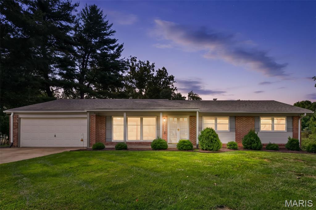 Fabulous ranch home in popular Bellerive Estates near Olive and Fee, in Parkway School District.  Located on a cul de sac, the home backs to trees and has a low maintenance deck plus brick front exterior, covered front porch and newer vinyl siding.  The interior is so light and bright, provided by the fresh coat of paint (7/26) and multiple windows.  The flooring is newer (7/26) vinyl luxury plank in the kitchen, family, front and dining rooms.  There is also newer (7/26) carpet in the bedrooms.  The eat in kitchen has nice cabinets-the lower cabinet has a lazy Susan for extra space, SS gas 4 burner stove, dishwasher, refrigerator, microwave and disposal.  There is a wood burning fireplace in the family room and door to the deck.  The spacious front living space offers many options with a beautiful picture window and view of the court. The primary suite has 2 closets and a full bathroom with a newer vanity and shower.  Other features include a large covered patio with  high ceiling , walk-out lower level, partial fencing, enclosed soffits, newer roof and siding, storm door, front covered porch, newer base boards, attic fan, large entry closet and hall linen closet. The trees in the backyard provide some privacy.  Close to shopping, schools and highways.  Roof 2020/Siding 2025/Electrical Panel 2025This home is a gem.