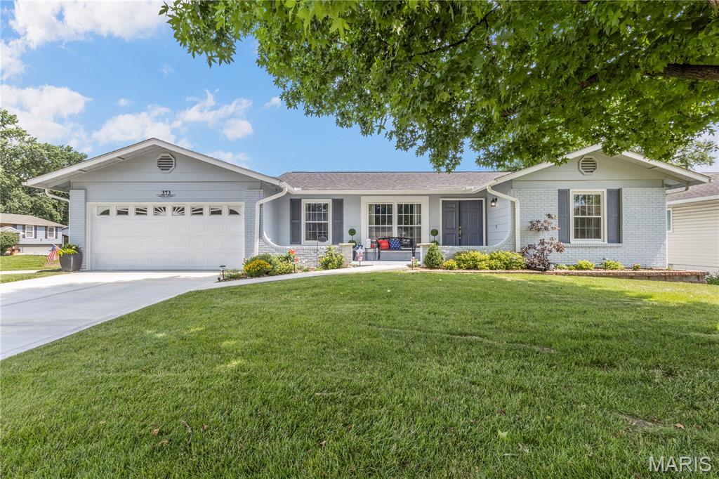 Welcome to your beautifully updated West County retreat! This stunning 3-bedroom, 2-bath home offers a bright, versatile floor plan paired with stylish modern updates designed for today's lifestyle.  Step inside to spacious, light-filled living and dining areas showcasing gorgeous hardwood floors and elegant designer lighting. The beautifully updated kitchen is a chef's delight, featuring oversized stainless steel sink, white painted wood cabinetry, generous counter space, and black appliances.  Joining the kitchen is a flexible living space perfect as a family room, breakfast area, or additional dining room. The main level also features a spacious primary suite offers two large closets and a private ensuite bath with shower, as well as 2 generously sized bedrooms, all with beautiful hardwood floors and ceiling fans, along with two tastefully remodeled bathrooms including a deep soaking tub in guest bath.  The attached two-car garage is finished with drywall, fresh paint, and durable epoxy flooring.  Step outside to your expansive private deck overlooking a mostly level, fully fenced backyard—ideal for summer barbecues, pets, playtime, and entertaining.  The finished lower level provides an impressive rec room with abundant space for entertaining, gaming, or relaxing, plus French doors leading to the patio. A bonus room offers endless possibilities as a home office, fitness room, playroom, or hobby space.  Highlights include ample storage, laundry area with natural window light, plush carpeting in the lower level, Major updates completed within the past three years include the roof, HVAC system, water heater, driveway, 4-inch baseboards, DW, and freshly painted deck.  The location is unbeatable! Enjoy a short walk to Sorrento Springs Elementary, along with convenient access to parks, shopping, restaurants, and Highway 141.  This truly turnkey home offers the perfect combination of style, comfort, space, and an exceptional West County location.