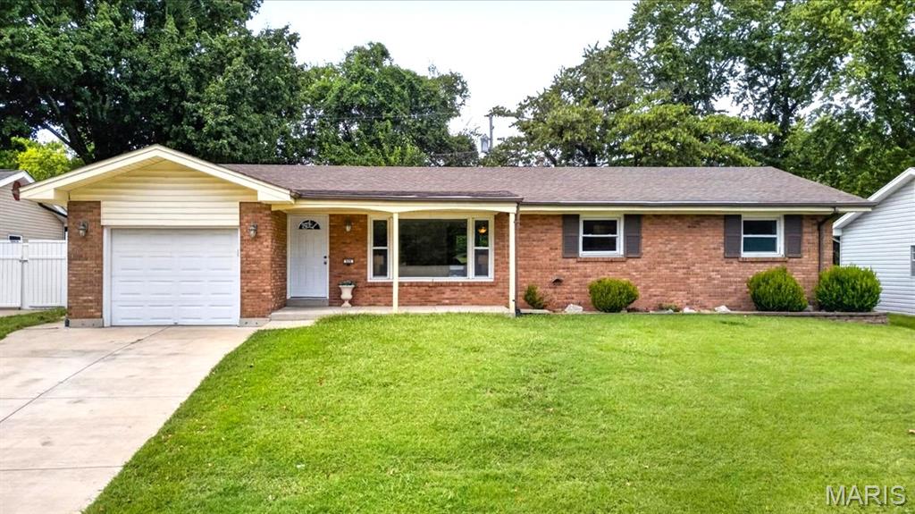 Welcome home to this charming 3-bedroom, 2.5-bath home in a convenient St. Charles location! From the moment you arrive, the covered front porch welcomes you in, while the bright and inviting interior offers an abundance of natural light throughout. Fresh paint and new interior doors provide a clean, refreshed feel, complemented by a mix of original hardwood flooring and LVP throughout the home.

The main living area flows naturally into the breakfast nook, creating a perfect combination of open and closed concept. Just beyond the kitchen, an additional flexible space offers endless possibilities—use it as a second formal dining area, cozy family room, home office, etc. This space also provides convenient access to the backyard and garage. The bedrooms are bright and welcoming, each benefiting from plenty of natural light. Downstairs, the unfinished basement offers valuable additional space and plenty of potential for future finishing, with trim work already underway and a finished half bathroom in place.

Outside, enjoy the fenced backyard featuring a small patio and shed, with plenty of opportunity to create your own private outdoor retreat. With its charming character, functional layout, fresh updates, and room to make it your own, this home is full of potential. Conveniently located less than 10 minutes from I-70 and historic Downtown St. Charles/Main Street, with McNair Park just a short walk away. Come see all that this adorable St. Charles home has to offer!
