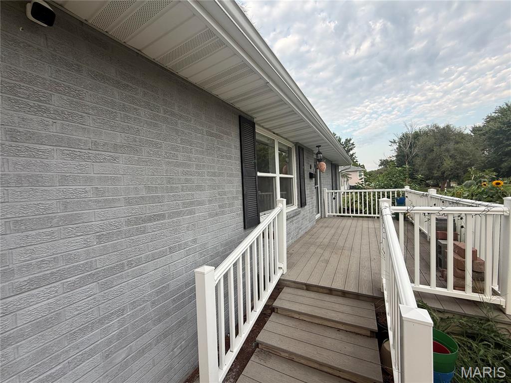 Discover this stunning all-brick ranch home, offering both durability and timeless appeal. With 2 bedrooms and 1 bath, this residence is perfect for those seeking a cozy yet functional living space. 
The refinished hardwood floors flow seamlessly throughout, enhancing the home's inviting atmosphere. Relax on the charming front porch or enjoy the privacy of the fenced backyard—ideal for outdoor gatherings or playtime with pets. The property also features a convenient one-car garage, providing additional storage and ease of access. Nestled in a quiet neighborhood, you're just moments away from schools and a nearby hospital, making this home a perfect blend of comfort and convenience. Don’t miss your chance to own this lovely all-brick ranch!