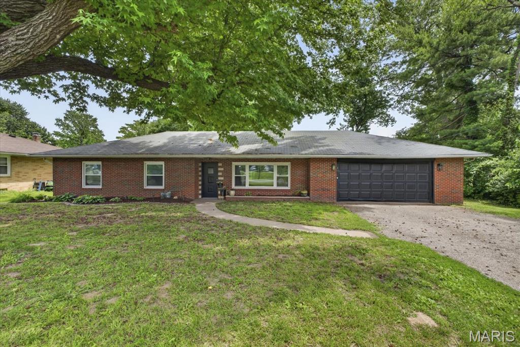 Welcome to 2404 Vandalia Road in Collinsville! This beautifully updated full brick ranch offers the perfect blend of character, comfort, and modern updates. Featuring 3 bedrooms, 2 full bathrooms, plus a versatile bonus room ideal for a home office, playroom, or potential 4th bedroom, this home provides flexible living space for today's lifestyle.

Step inside to find numerous tasteful updates throughout, including a completely refreshed kitchen, updated bathrooms, remodeled laundry room, fresh paint, and updated flooring. The home also features all new plumbing for added peace of mind. The spacious kitchen offers ample cabinetry, a breakfast bar, and flows seamlessly into the living and dining areas, making it perfect for everyday living and entertaining.

Outside, enjoy the large yard from the brand-new deck, creating the perfect space for morning coffee, grilling, or gathering with family and friends. The attached garage offers additional storage and convenient access to the home. Conveniently located near shopping, dining, entertainment, and interstate access, this move-in-ready home is one you won't want to miss!