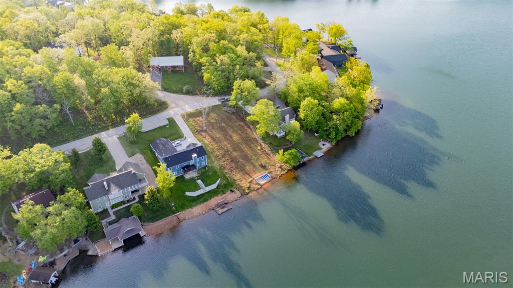 Lakefront Lot with Gorgeous Views of Lac Shayne – Build-Ready with Private Beach!!! Don’t miss this rare opportunity to own one of the few build-ready lakefront lots on Lac Shayne—one of the four ski lakes in the highly desirable Terre Du Lac community. This lot is cleared, gently sloped, and ready for your dream home. Whether you’re looking to build now or simply enjoy the water from your own private beach, this property delivers immediate lifestyle value including: lakefront property with stunning views of the Lac Shayne Dam, private beach access + community boat ramp, all utilities available (water, sewer, electric, and high-speed internet), and located on paved roads in an established neighborhood. You’ll love the gradual entry into the lake, ideal for swimming, paddleboarding, or just lounging by the shore. Build now or hold as a smart investment in one of the area's most scenic spots.