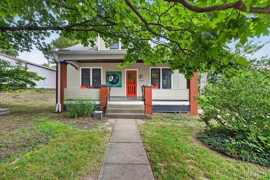 Step into a piece of Augusta history with this beautifully preserved and thoughtfully maintained 1937 home, where timeless charm meets everyday comfort. Situated on nearly an acre in the heart of Missouri Wine Country, this 4-bedroom, 2-bath residence offers over 2,000 square feet of inviting living space filled with original character, warm wood flooring, and abundant natural light. From the moment you arrive, the welcoming covered front porch sets the tone for the home's classic appeal. Inside, spacious living and dining rooms provide the perfect backdrop for entertaining, while the bright kitchen offers generous cabinetry, ample workspace, and a functional layout that blends vintage charm with modern convenience. The flexible floor plan features two bedrooms on the main level and two additional bedrooms upstairs, creating plenty of space for family, guests, or a home office. An expansive upper-level bonus room offers endless possibilities as a media room, playroom, studio, or additional living space. The unfinished basement provides abundant storage and workshop space, while the tuck-under area offers the opportunity to create a garage by simply adding the mechanics. Outside, the nearly one-acre level lot provides room to garden, a chicken coop, entertaining space, and peaceful surroundings beneath mature shade trees. Located just moments from Augusta's award-winning wineries, local restaurants, boutique shopping, scenic bike trails, and the Katy Trail, this home offers the perfect blend of small-town charm and country living while remaining conveniently accessible to St. Charles and St. Louis County. Whether you're looking for a full-time residence, weekend retreat, or investment opportunity in one of Missouri's most desirable destinations, this property is truly one of a kind.